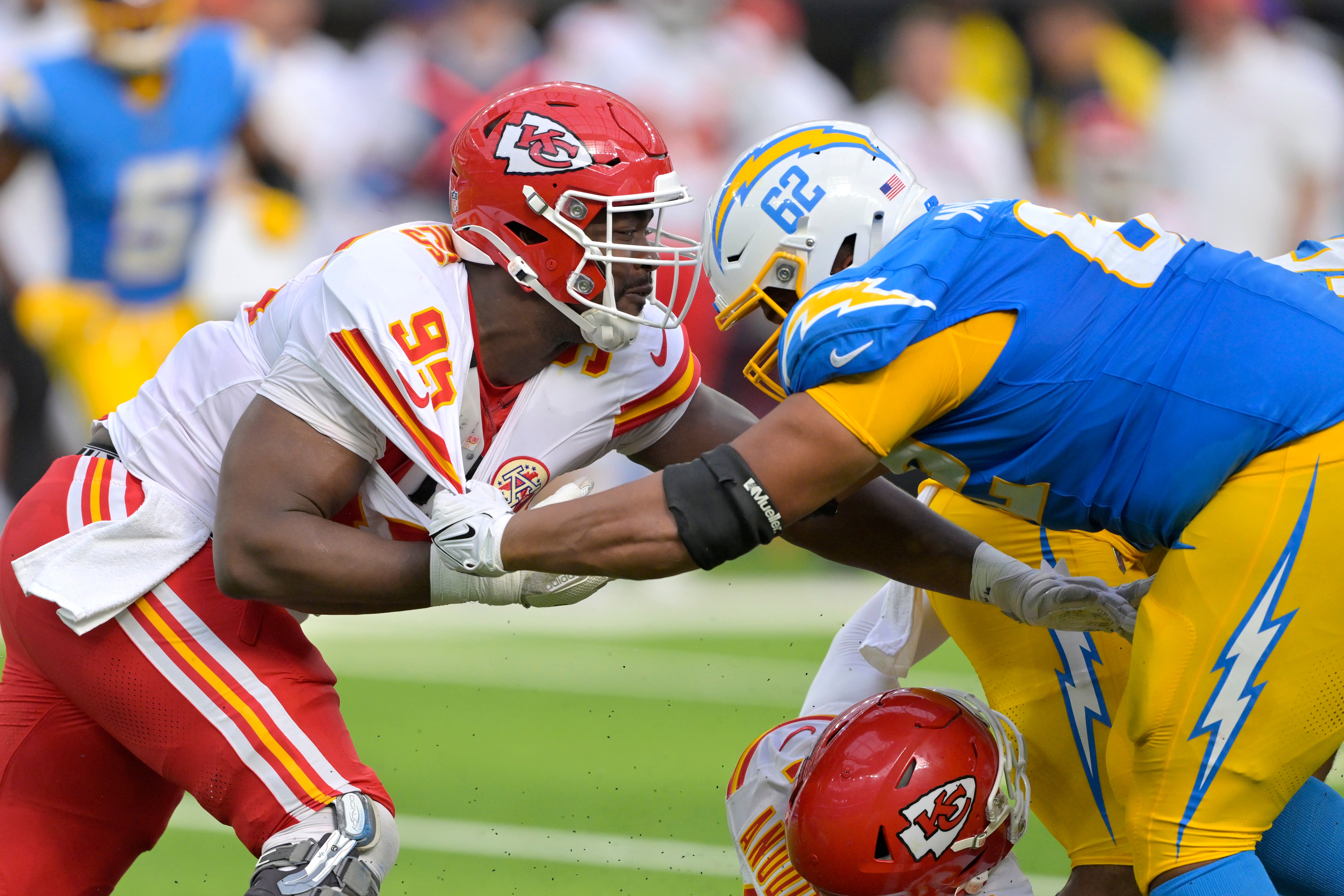 Sep 29, 2024; Inglewood, California, USA; Kansas City Chiefs defensive tackle Chris Jones (95) and Los Angeles Chargers center Sam Mustipher (62) battle at the line in the second half at SoFi Stadium.