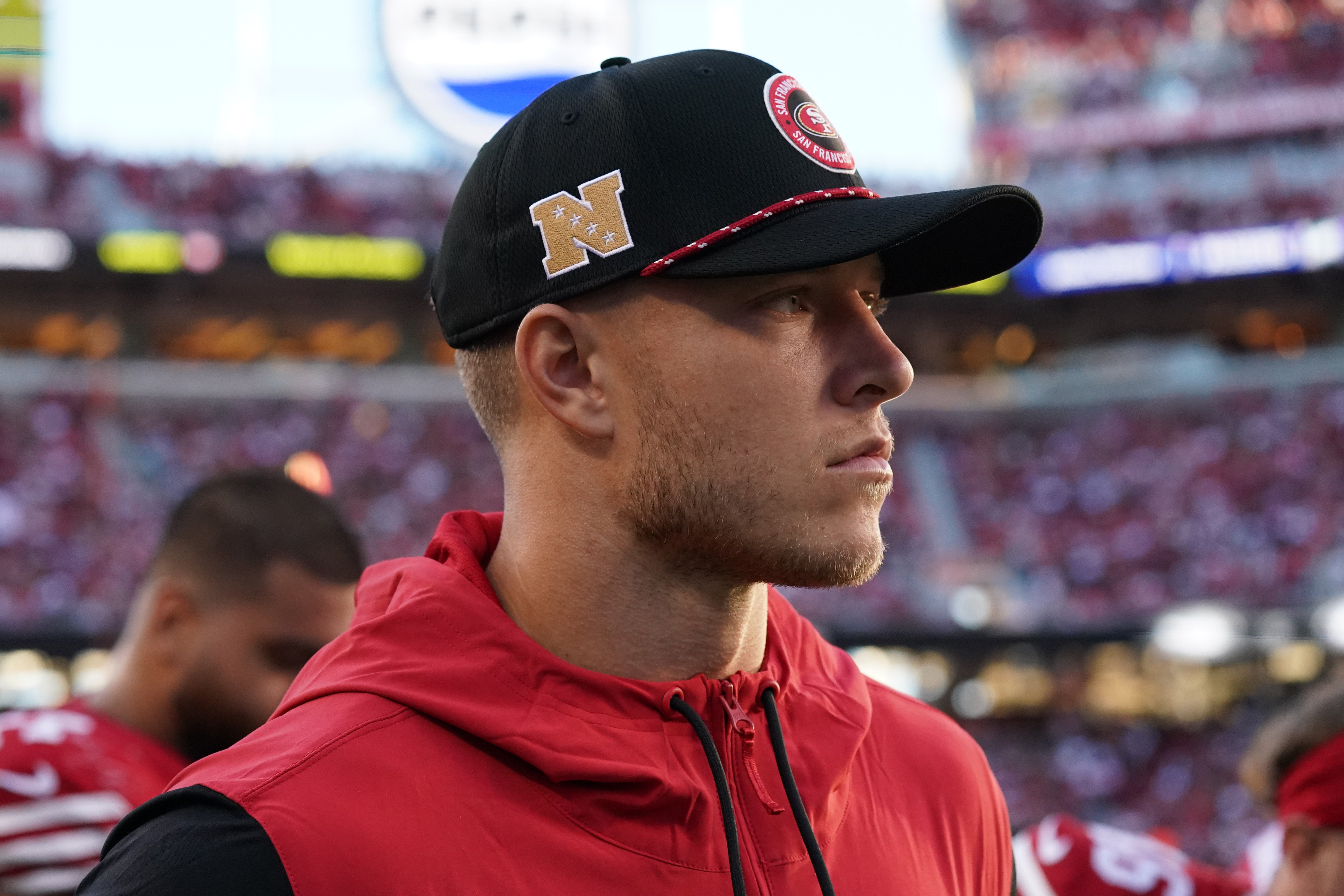 San Francisco 49ers running back Christian McCaffrey (23) watches injured from the sidelines in the second quarter against the New York Jets at Levi's Stadium.