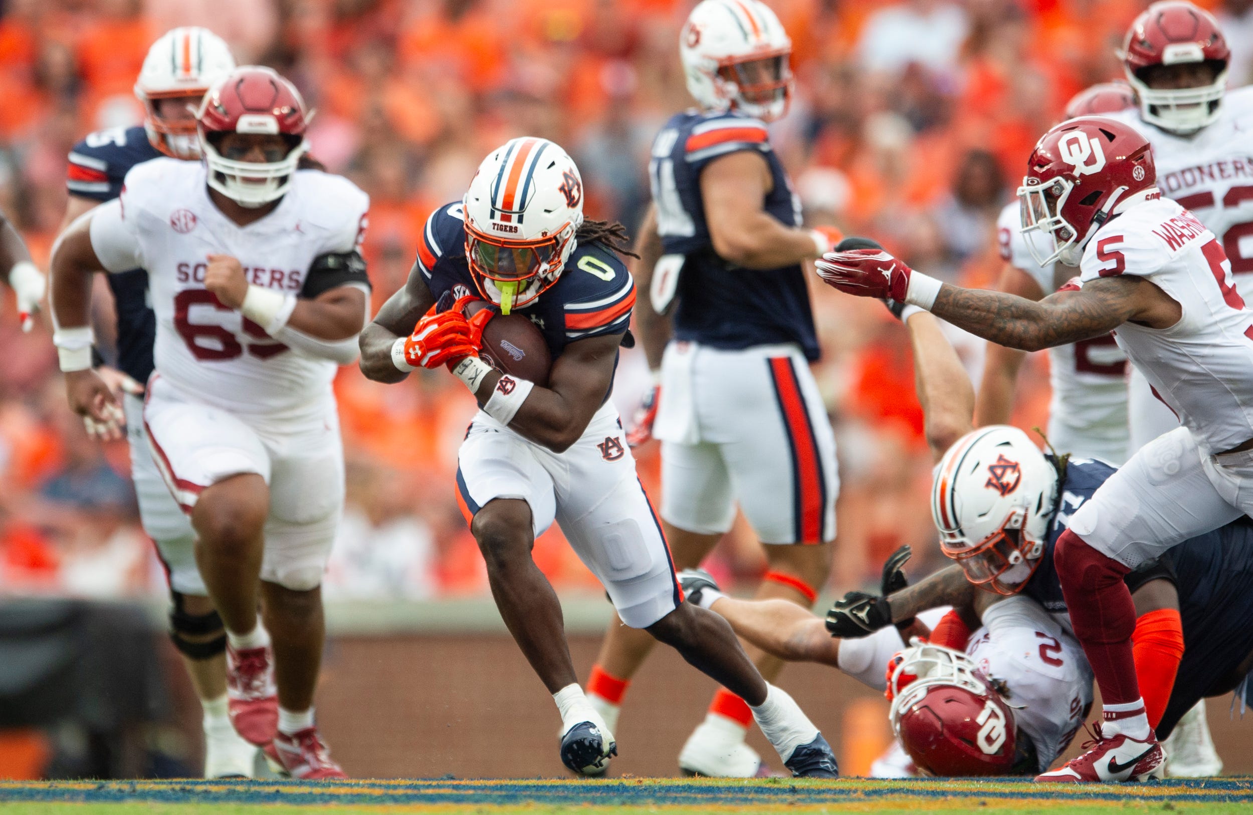 Auburn Tigers running back Damari Alston (0) runs the ball as Auburn Tigers take on Oklahoma Sooners at Jordan-Hare Stadium in Auburn, Ala., on Saturday, Sept. 28, 2024. Auburn Tigers lead Oklahoma Sooners 14-7 at halftime.