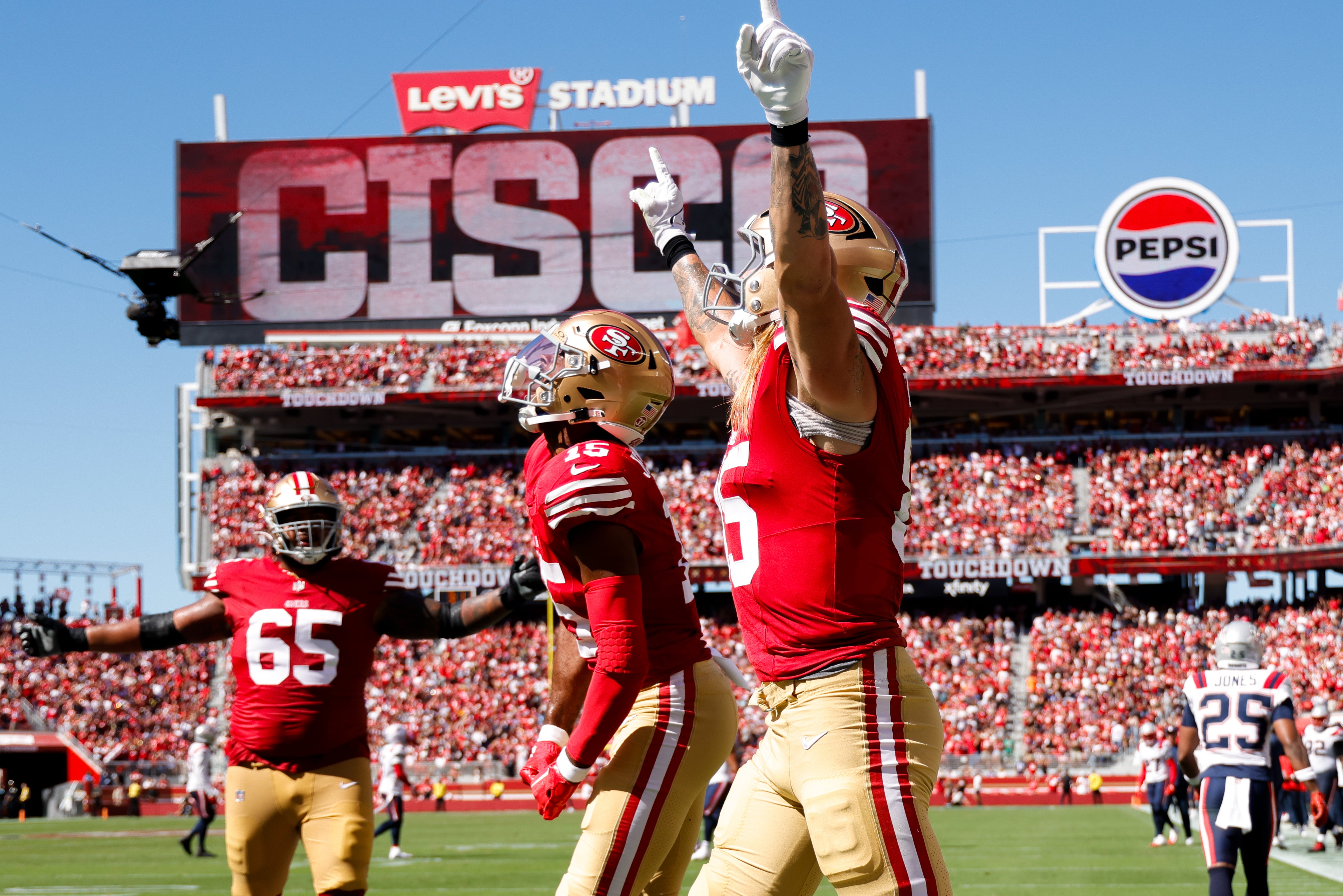San Francisco 49ers tight end George Kittle (85) celebrates with wide receiver Jauan Jennings (15) after a touchdown against the New England Patriots during the second quarter at Levi's Stadium.