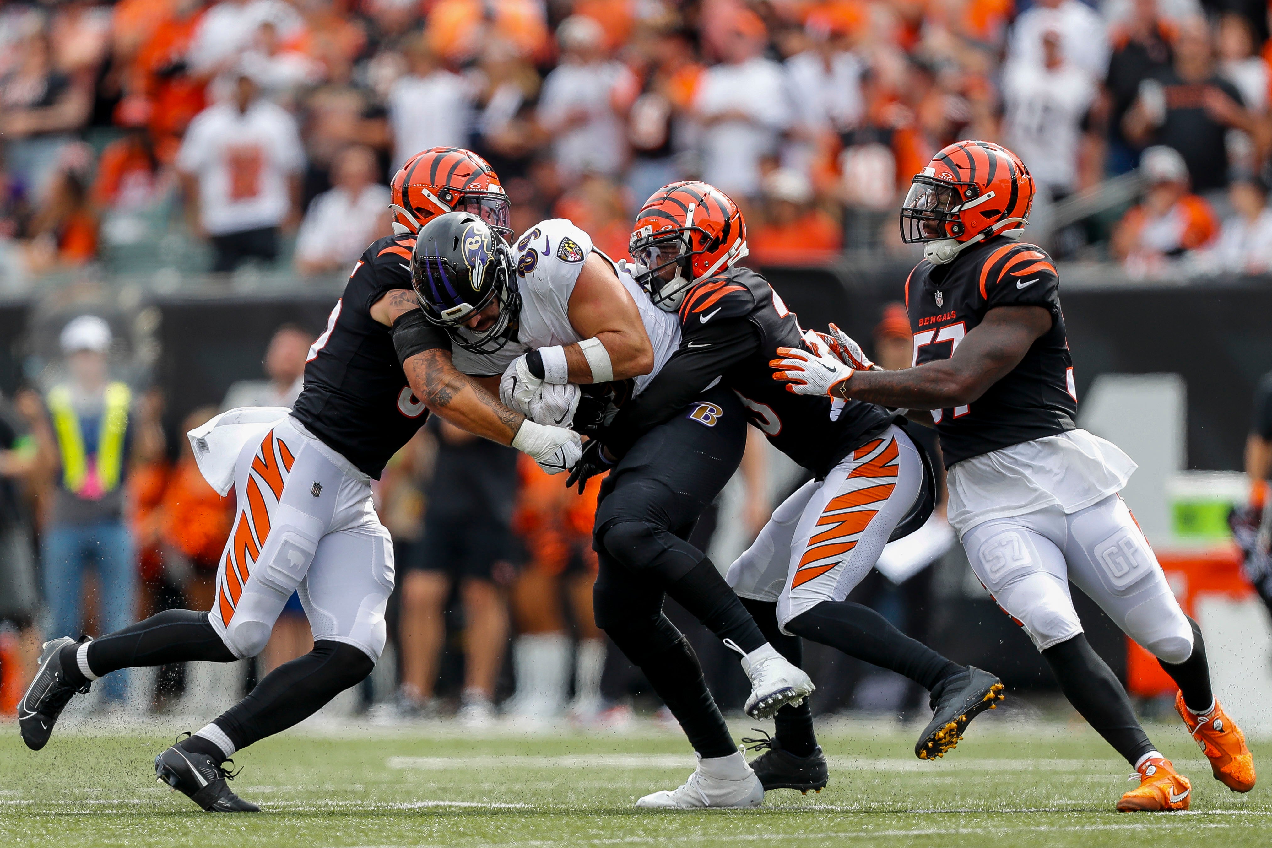 Sep 17, 2023; Cincinnati, Ohio, USA; Baltimore Ravens tight end Mark Andrews (89) runs with the ball against Cincinnati Bengals linebacker Logan Wilson (55), safety Dax Hill (23) and linebacker Germaine Pratt (57) in the second half at Paycor Stadium.