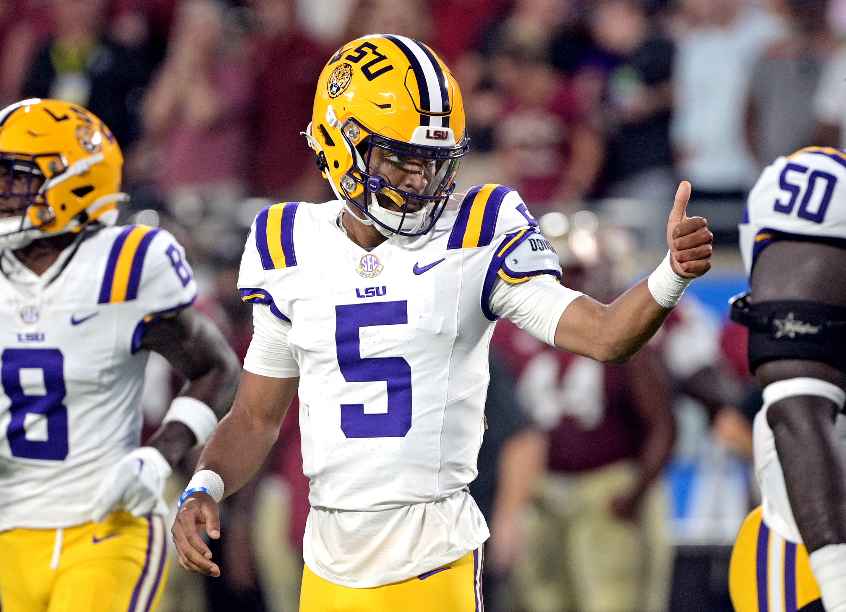 Sep 3, 2023; Orlando, Florida, USA; LSU Tigers quarterback Jayden Daniels (5) gives a thumbs up during the first half against the Florida State Seminoles at Camping World Stadium.