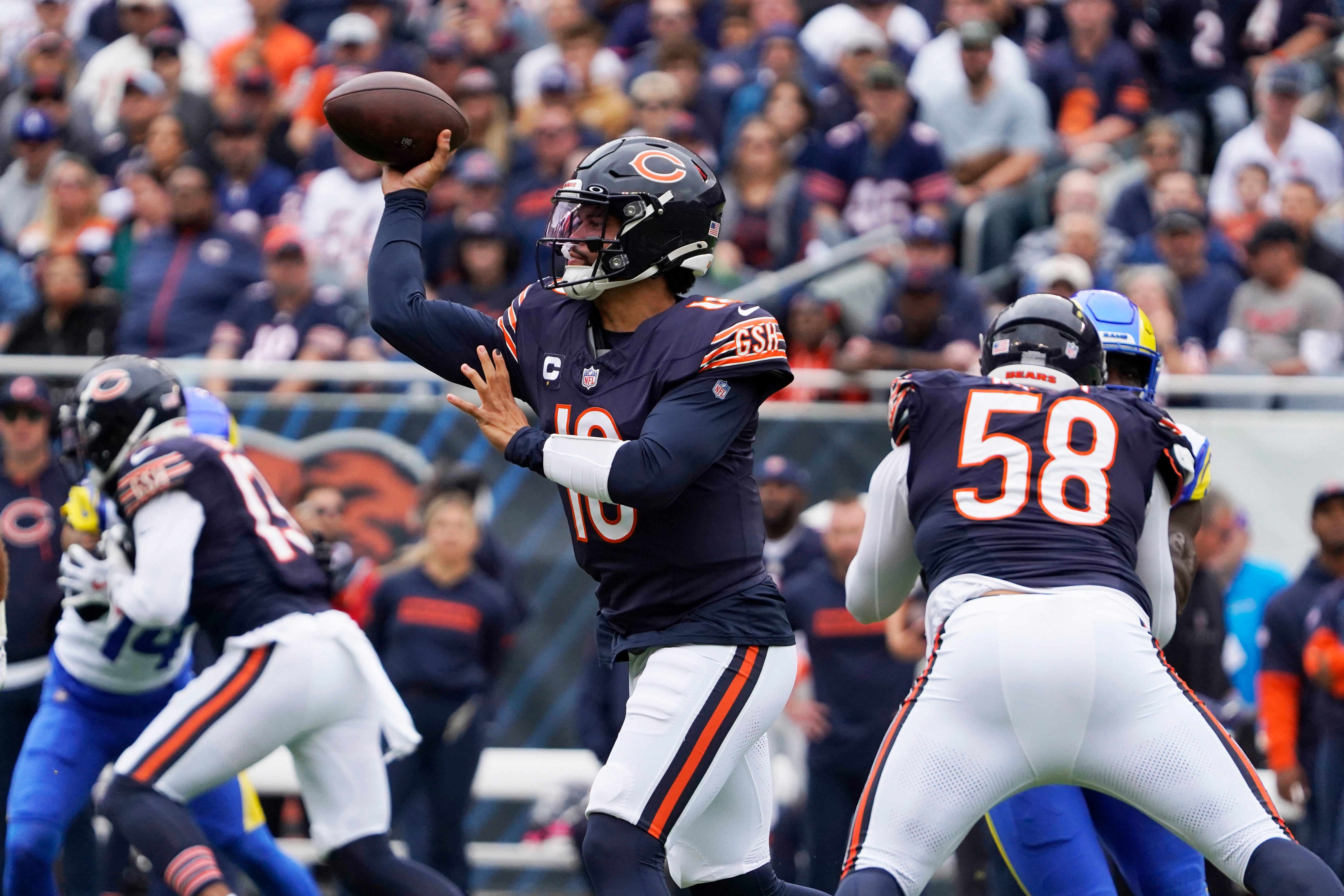 Sep 29, 2024; Chicago, Illinois, USA; Chicago Bears quarterback Caleb Williams (18) passes against the Los Angeles Rams during the first half at Soldier Field.