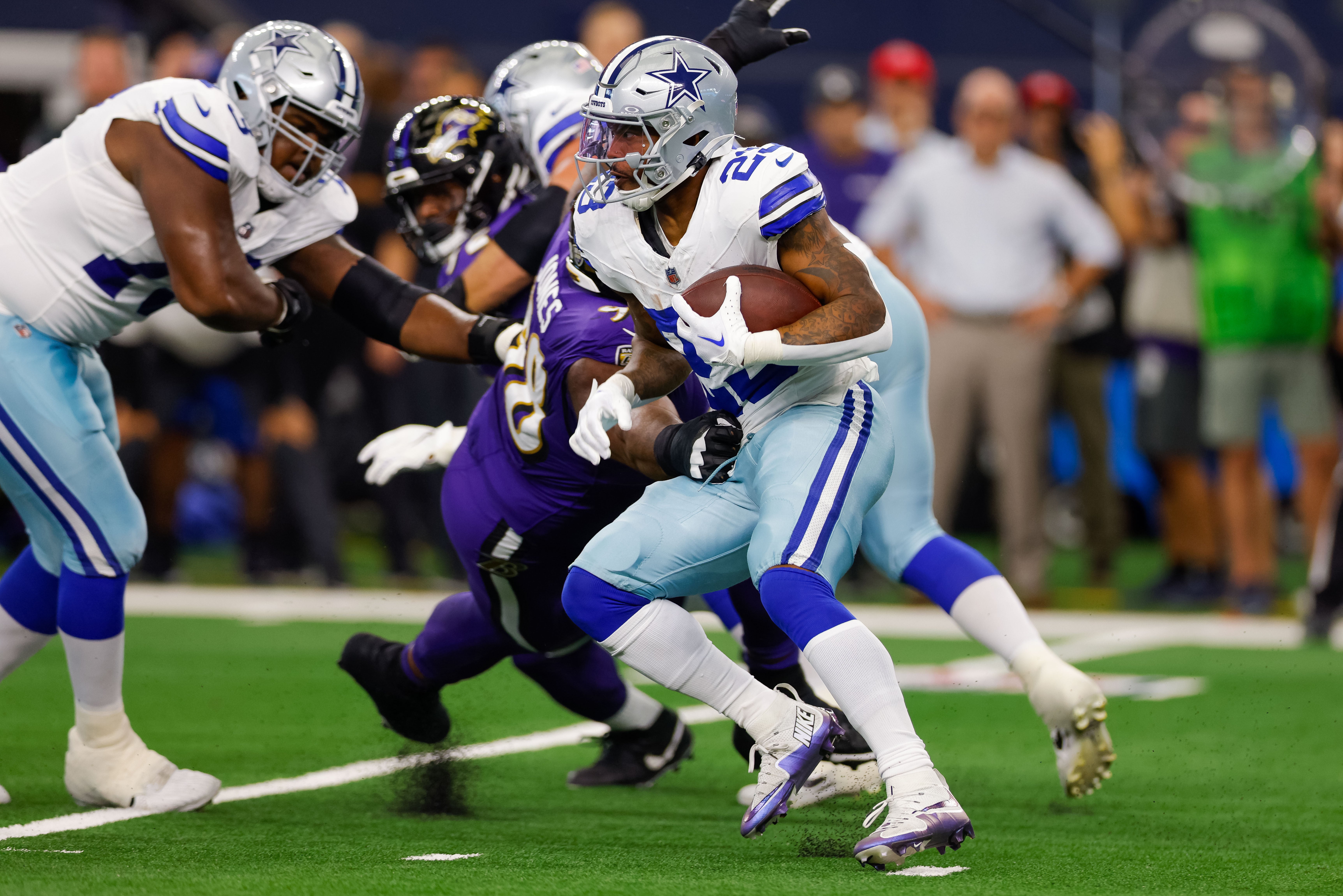 Dallas Cowboys running back Rico Dowdle (23) rushes with the ball during the first quarter against the Baltimore Ravens at AT&T Stadium.