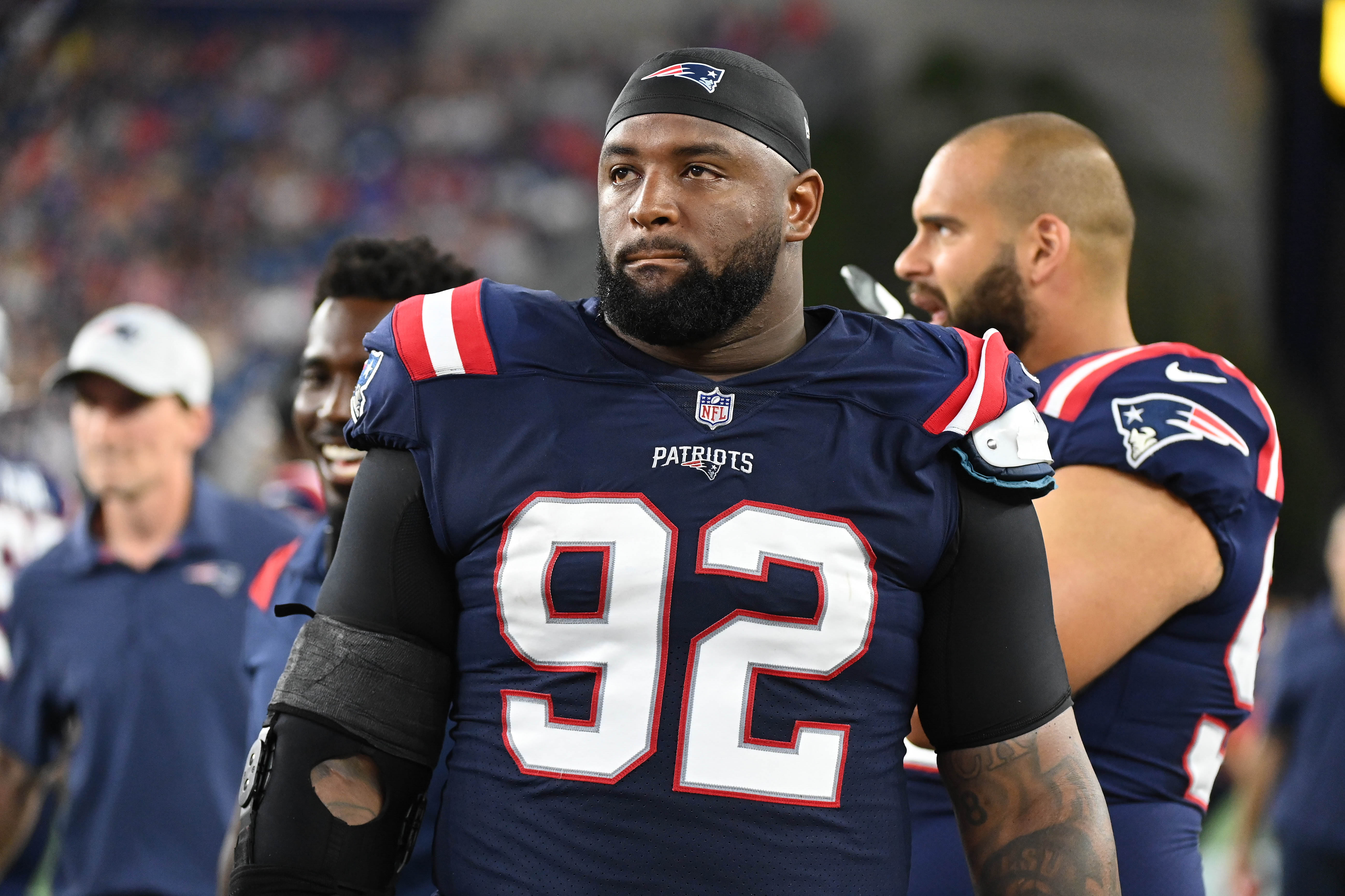 Aug 19, 2022; Foxborough, Massachusetts, USA; New England Patriots defensive tackle Davon Godchaux (92) on the sideline during the first half of a preseason game against the Carolina Panthers at Gillette Stadium.