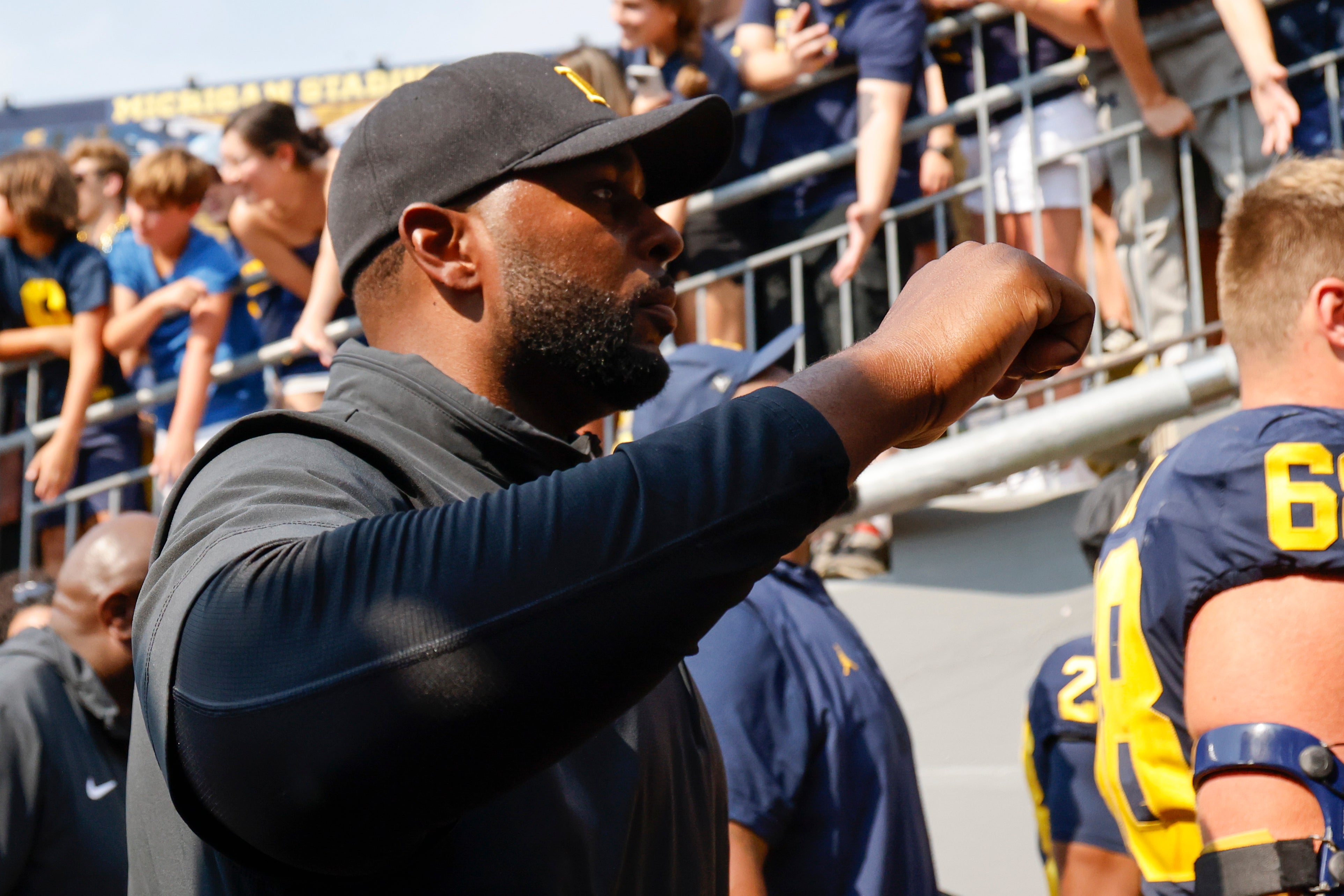 Sep 14, 2024; Ann Arbor, Michigan, USA; Michigan Wolverines head coach Sherrone Moore walks off the field after a game against the Arkansas State Red Wolves at Michigan Stadium.