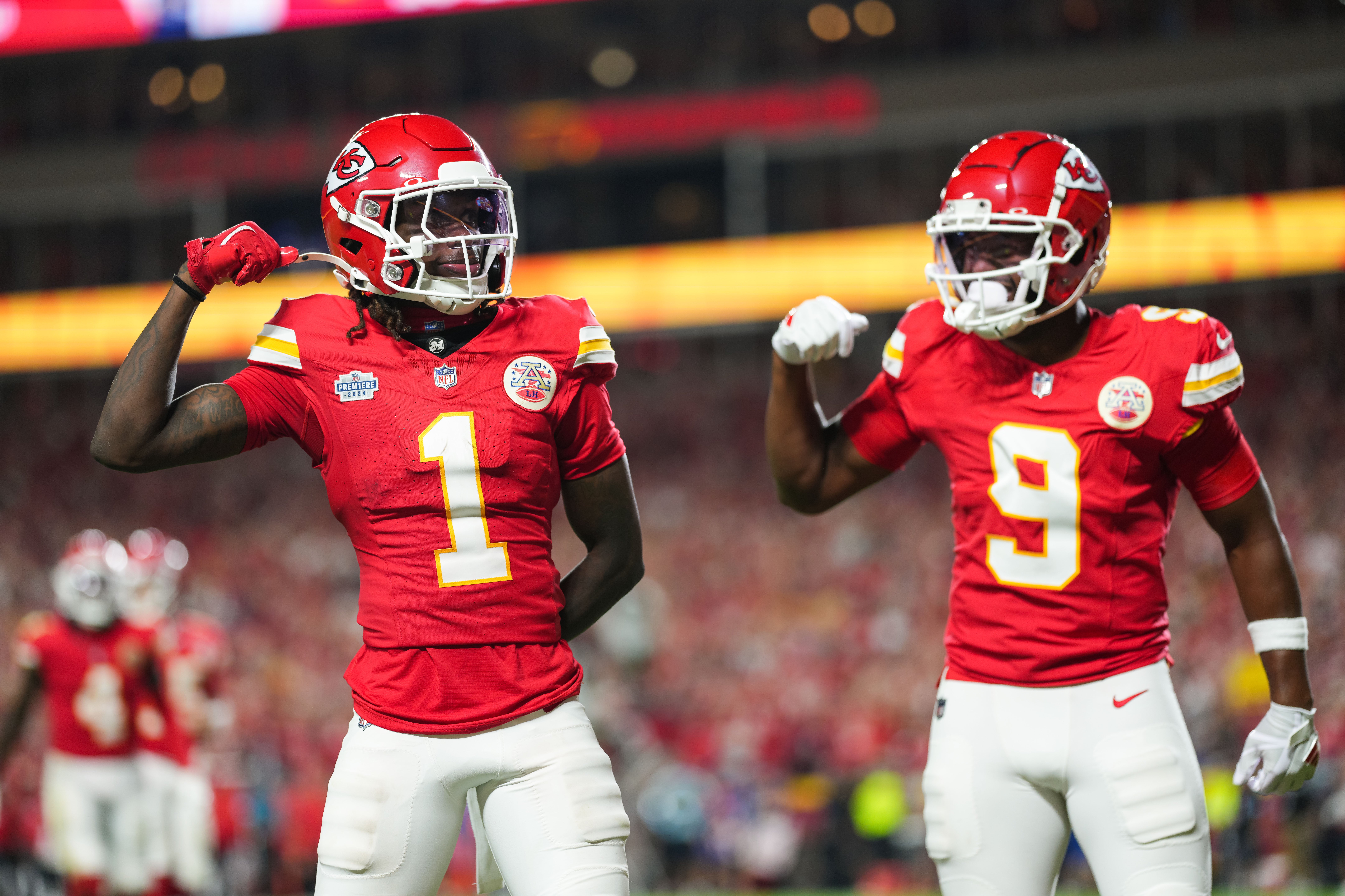 Chiefs wide receiver's Xavier Worthy and JuJu Smith-Schuster celebrate after scoring a touchdown.
