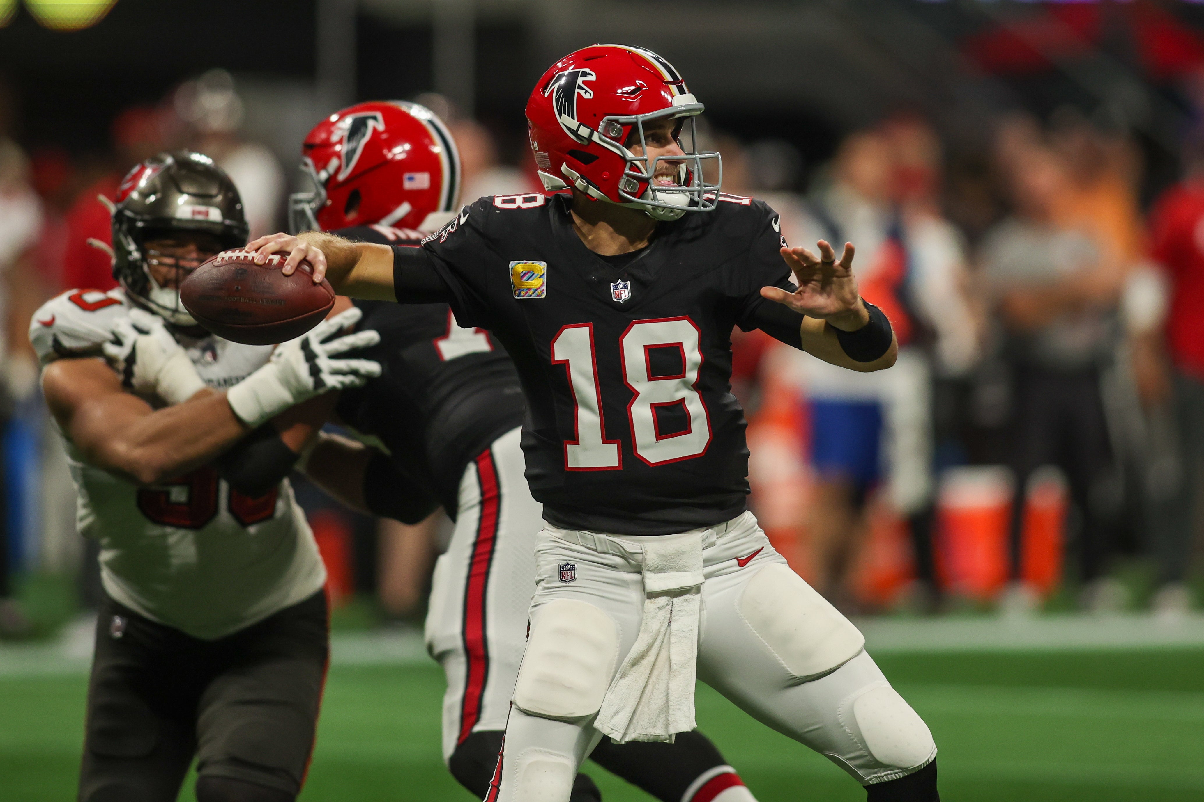 Falcons quarterback Kirk Cousins throws against the Buccaneers in the second quarter at Mercedes-Benz Stadium.