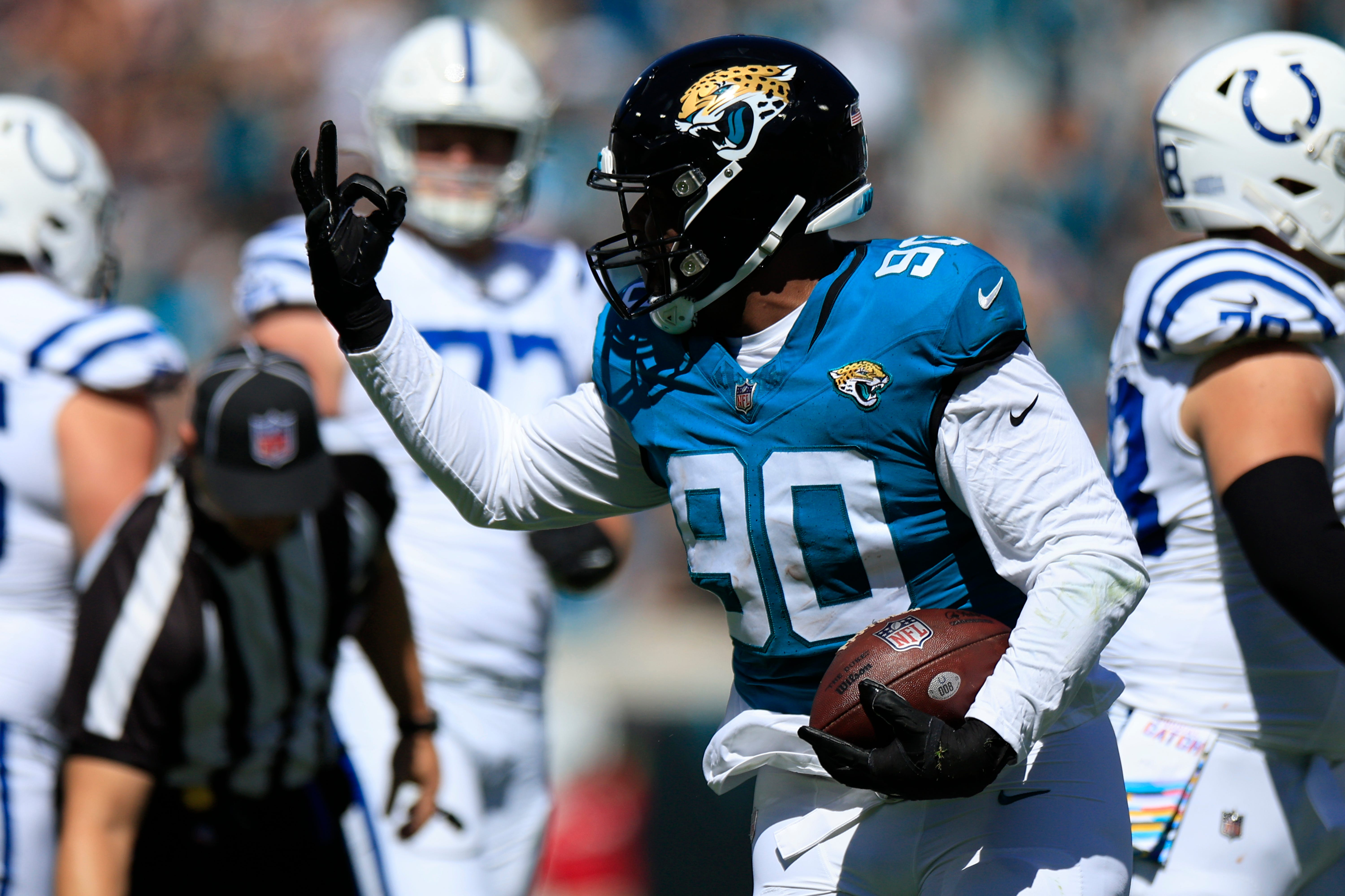 Jacksonville Jaguars defensive end Angelo Blackson (90) reacts to picking up the ball on a fumble turnover during the second quarter of an NFL football matchup Sunday, Oct. 15, 2023 at EverBank Stadium in Jacksonville, Fla. The Jacksonville Jaguars defeated the Indianapolis Colts 37-20.