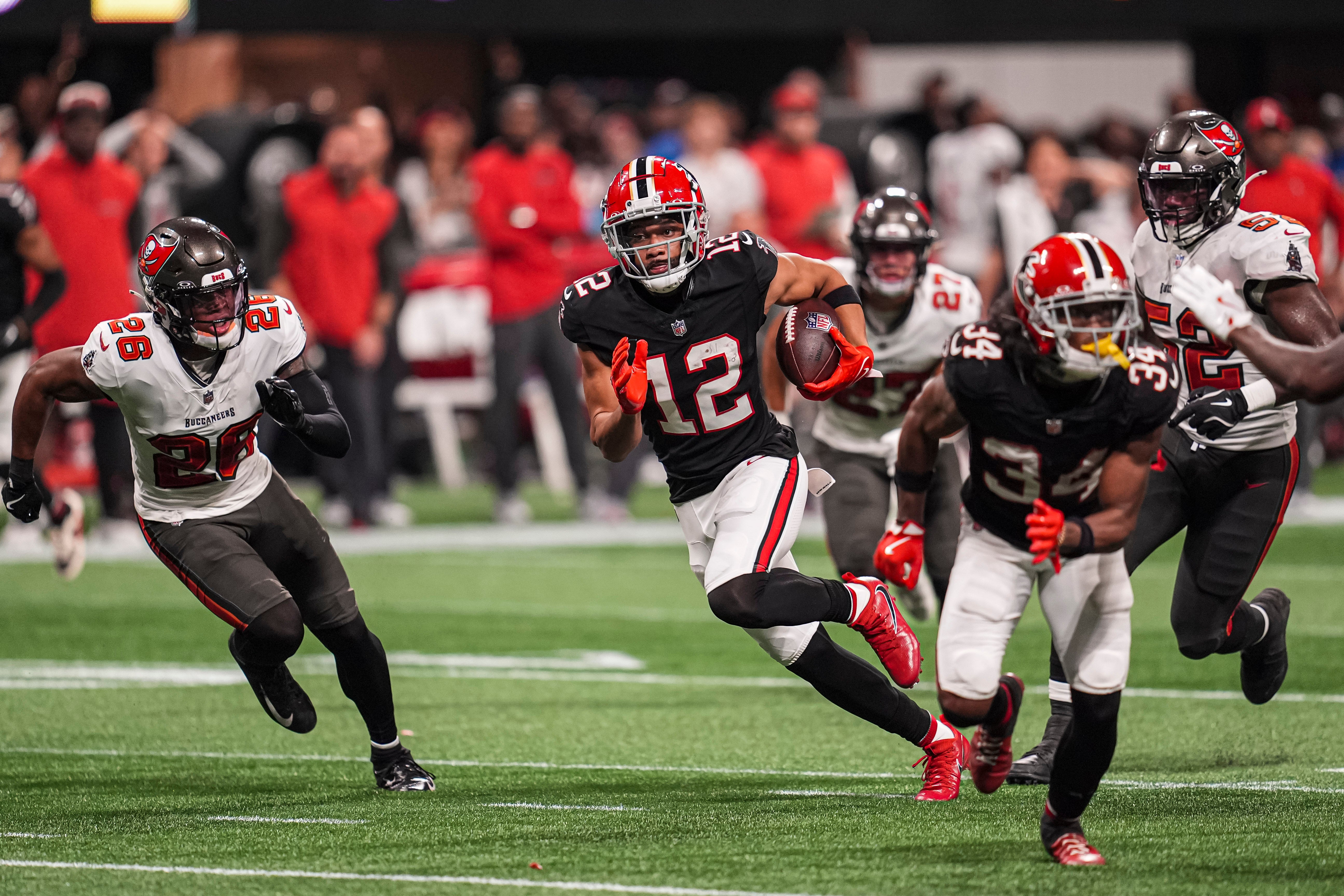 Oct 3, 2024; Atlanta, Georgia, USA; Atlanta Falcons wide receiver KhaDarel Hodge (12) runs for the game winning touchdown against the Tampa Bay Buccaneers in overtime at Mercedes-Benz Stadium.