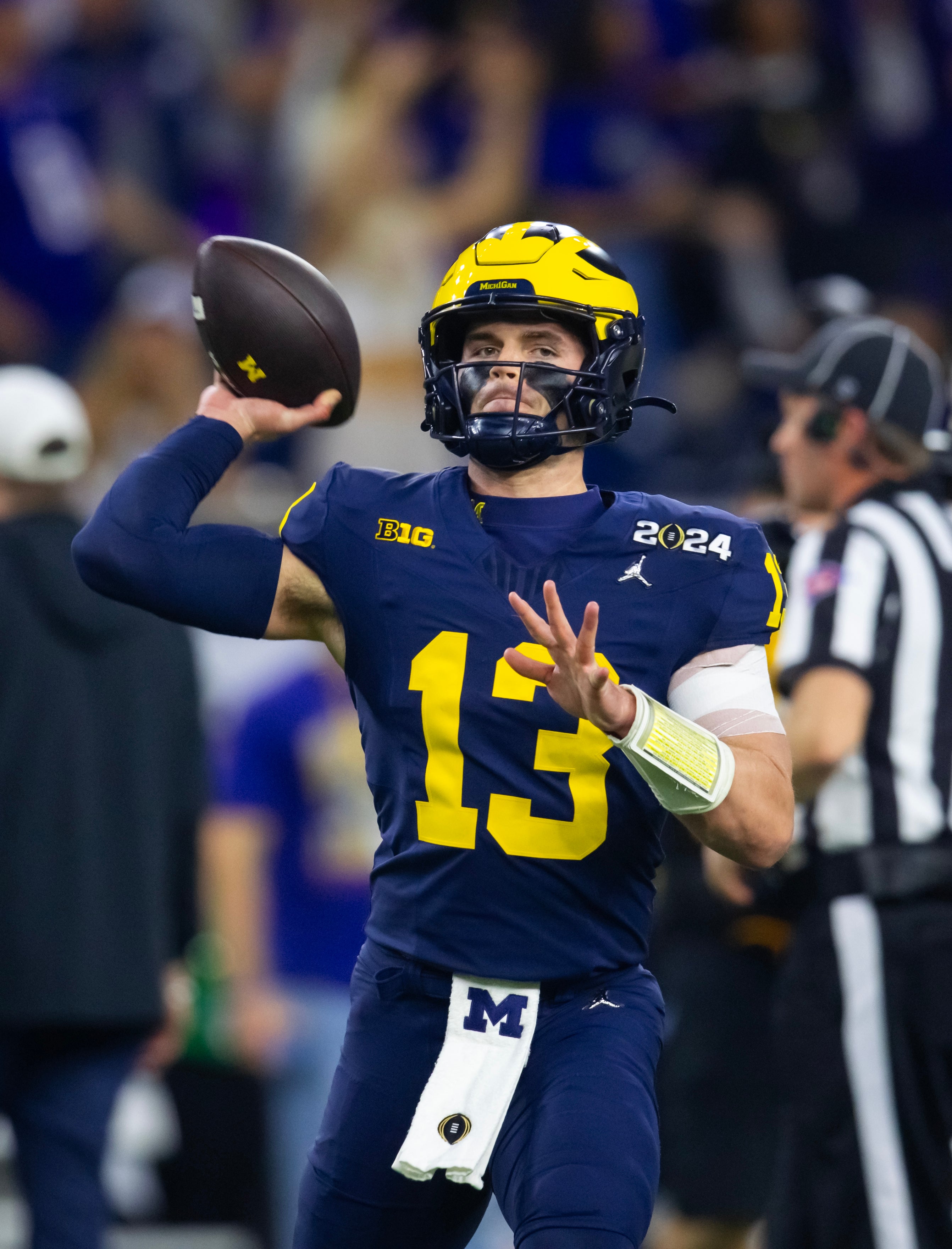 Jan 8, 2024; Houston, TX, USA; Michigan Wolverines quarterback Jack Tuttle (13) against the Washington Huskies during the 2024 College Football Playoff national championship game at NRG Stadium.