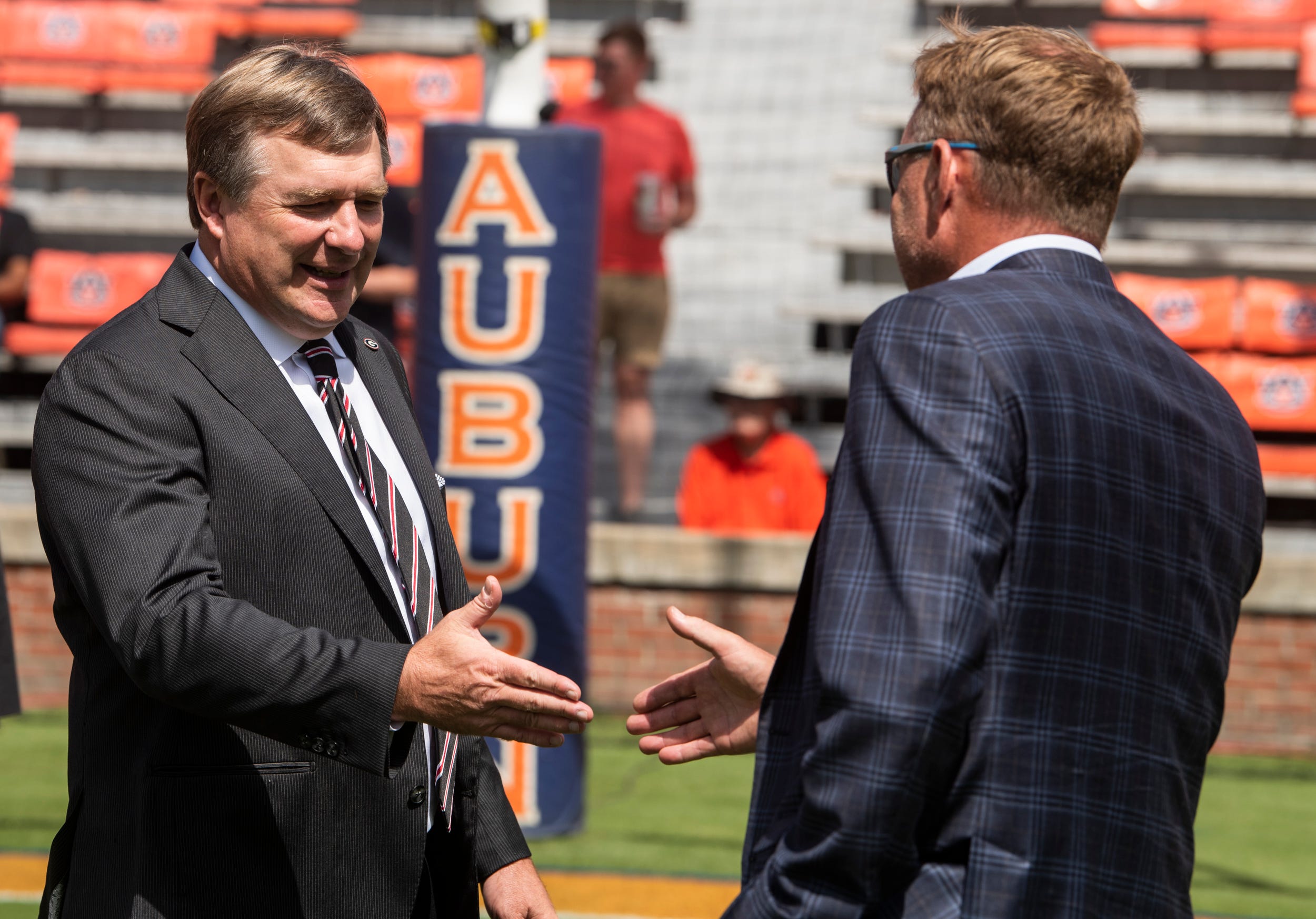 Auburn Tigers head coach Hugh Freeze and Georgia Bulldogs head coach Kirby Smart talk before Auburn Tigers take on Georgia Bulldogs at Jordan-Hare Stadium in Auburn, Ala., on Saturday, Sept. 30, 2023.