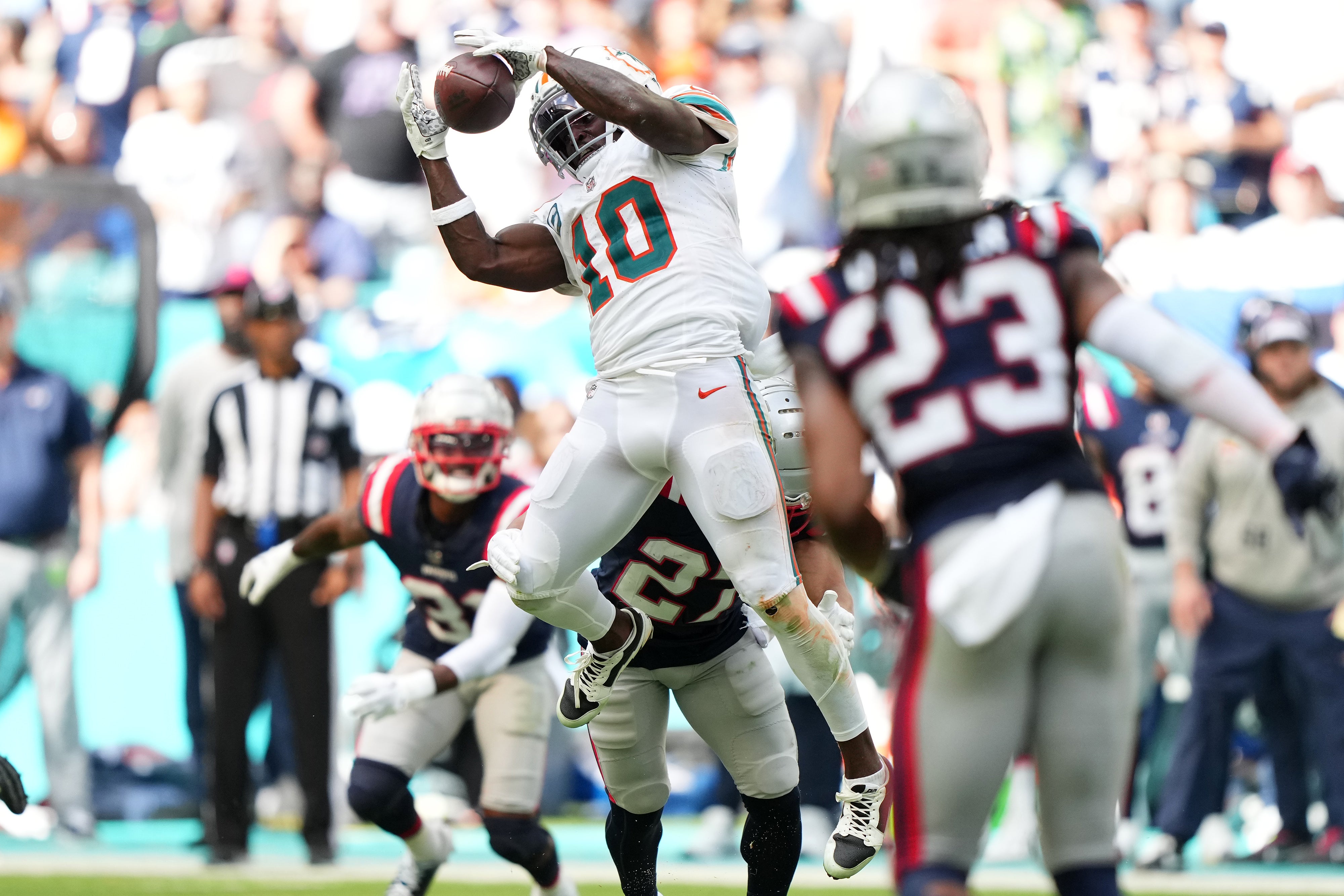 Oct 29, 2023; Miami Gardens, Florida, USA; Miami Dolphins wide receiver Tyreek Hill (10) makes a catch against the New England Patriots during the second half at Hard Rock Stadium.