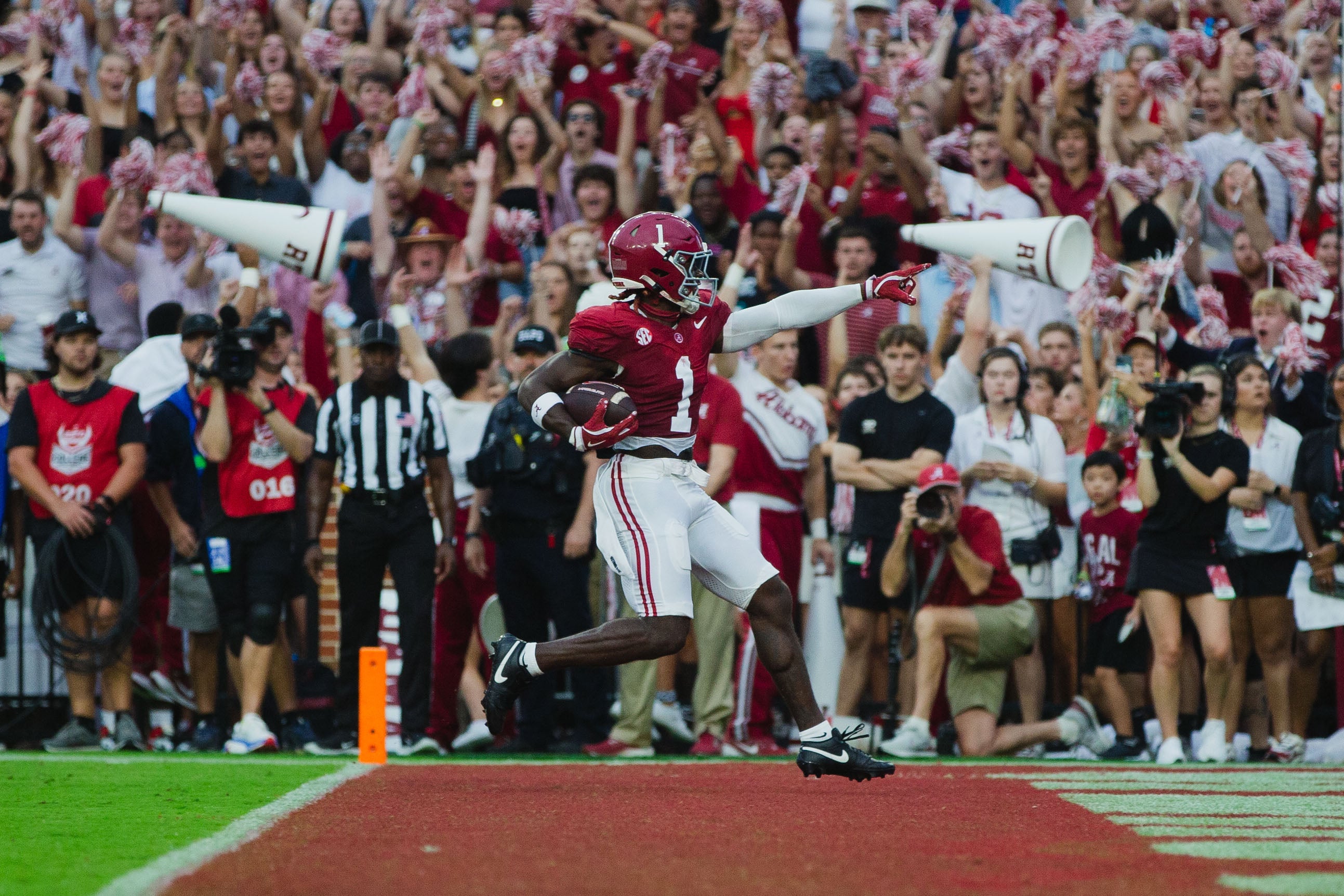 Aug 31, 2024; Tuscaloosa, Alabama, USA; Alabama Crimson Tide wide receiver Kendrick Law (1) scores a touchdown against the Western Kentucky Hilltoppers during the first quarter at Bryant-Denny Stadium.