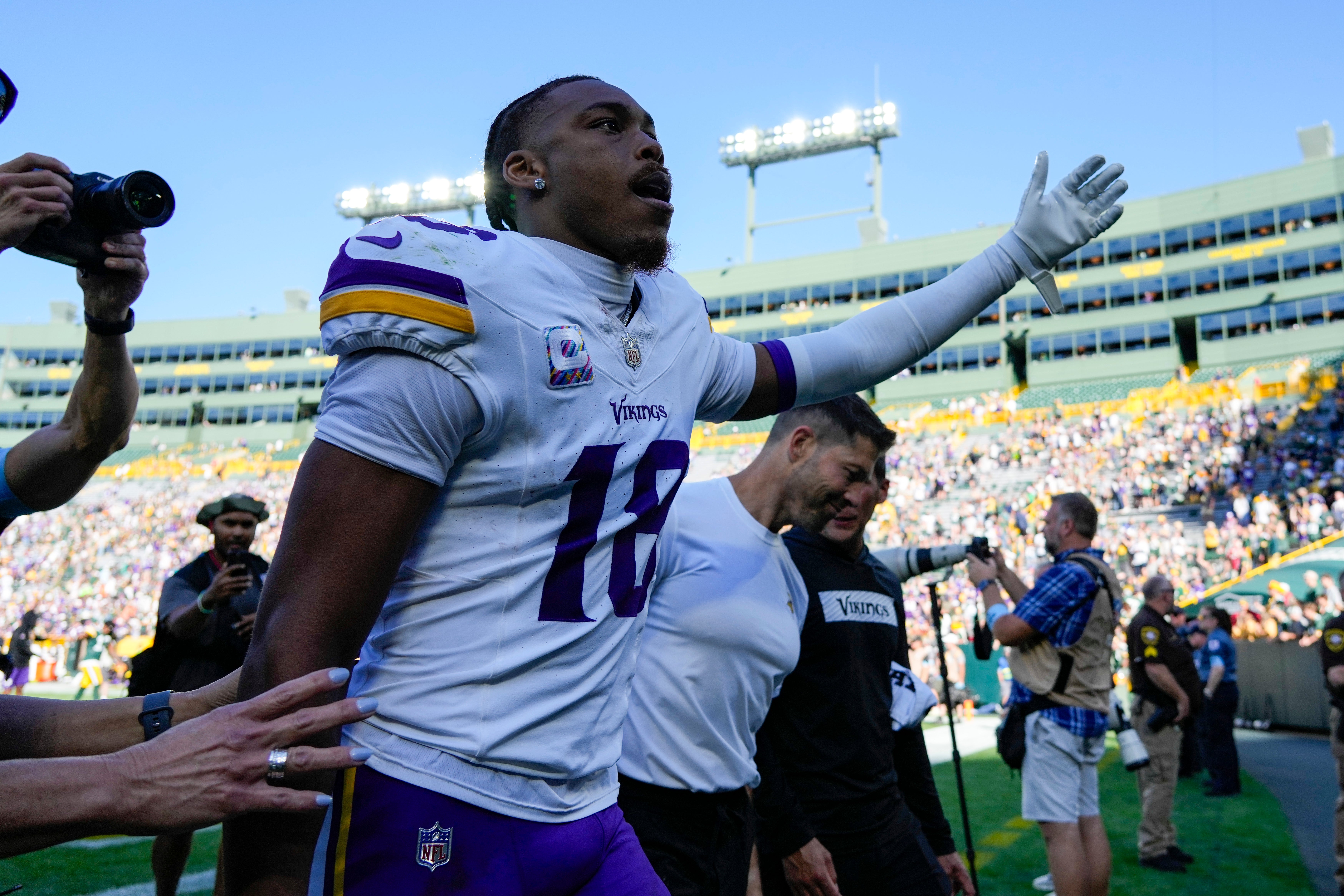 Sep 29, 2024; Green Bay, Wisconsin, USA; Minnesota Vikings wide receiver Justin Jefferson (18) gestures to fans while leaving the field following the game against the Green Bay Packers at Lambeau Field.