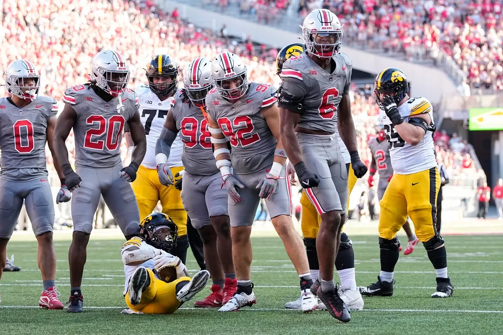 Ohio State Buckeyes safety Sonny Styles (6) celebrates a stop of Iowa Hawkeyes running back Jaziun Patterson (9) during the first half of the NCAA football game at Ohio Stadium