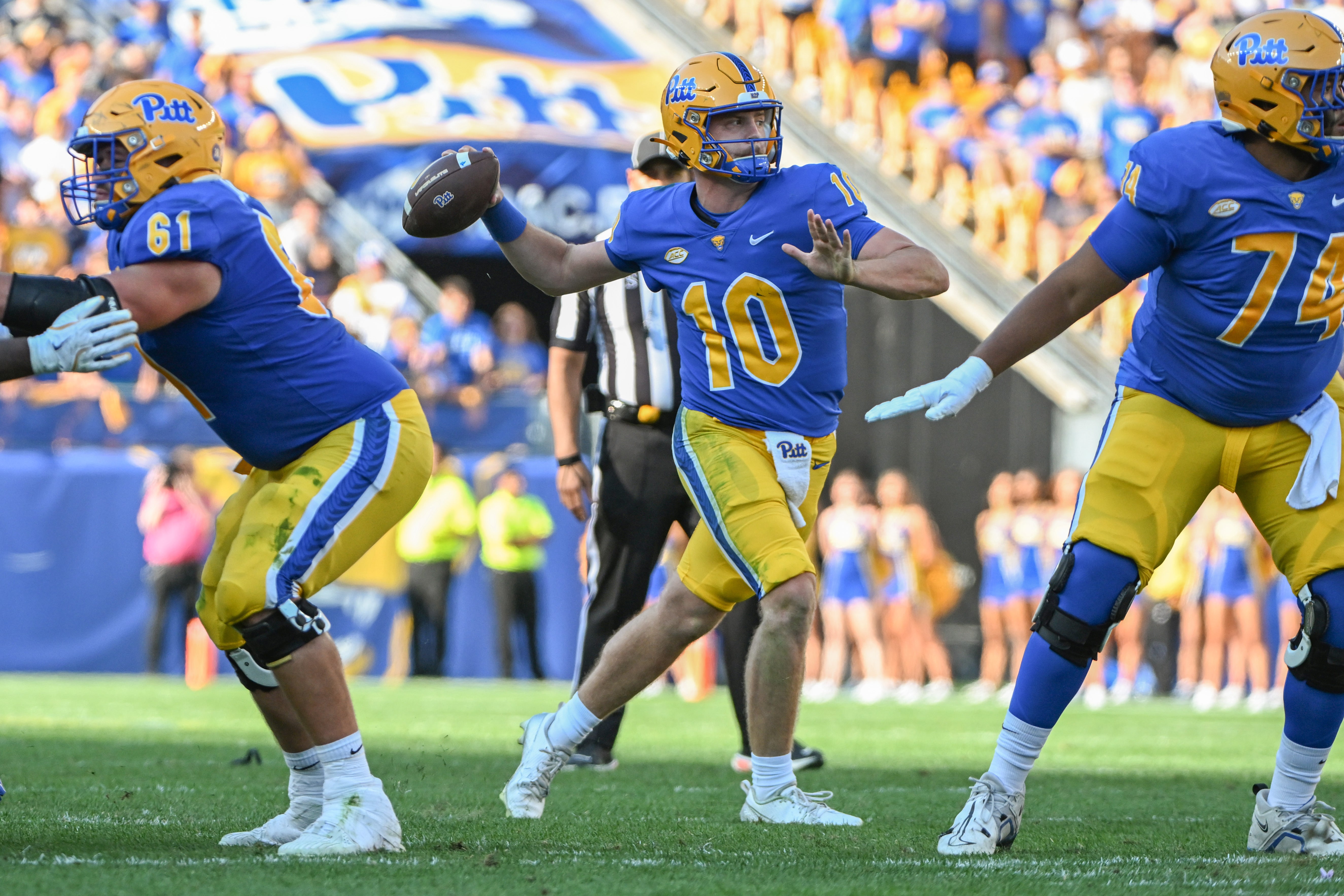 Sep 14, 2024; Pittsburgh, Pennsylvania, USA; Pittsburgh Panthers quarterback Eli Holstein (10) throws a touchdown pass against the West Virginia Mountaineers during the second quarter at Acrisure Stadium.
