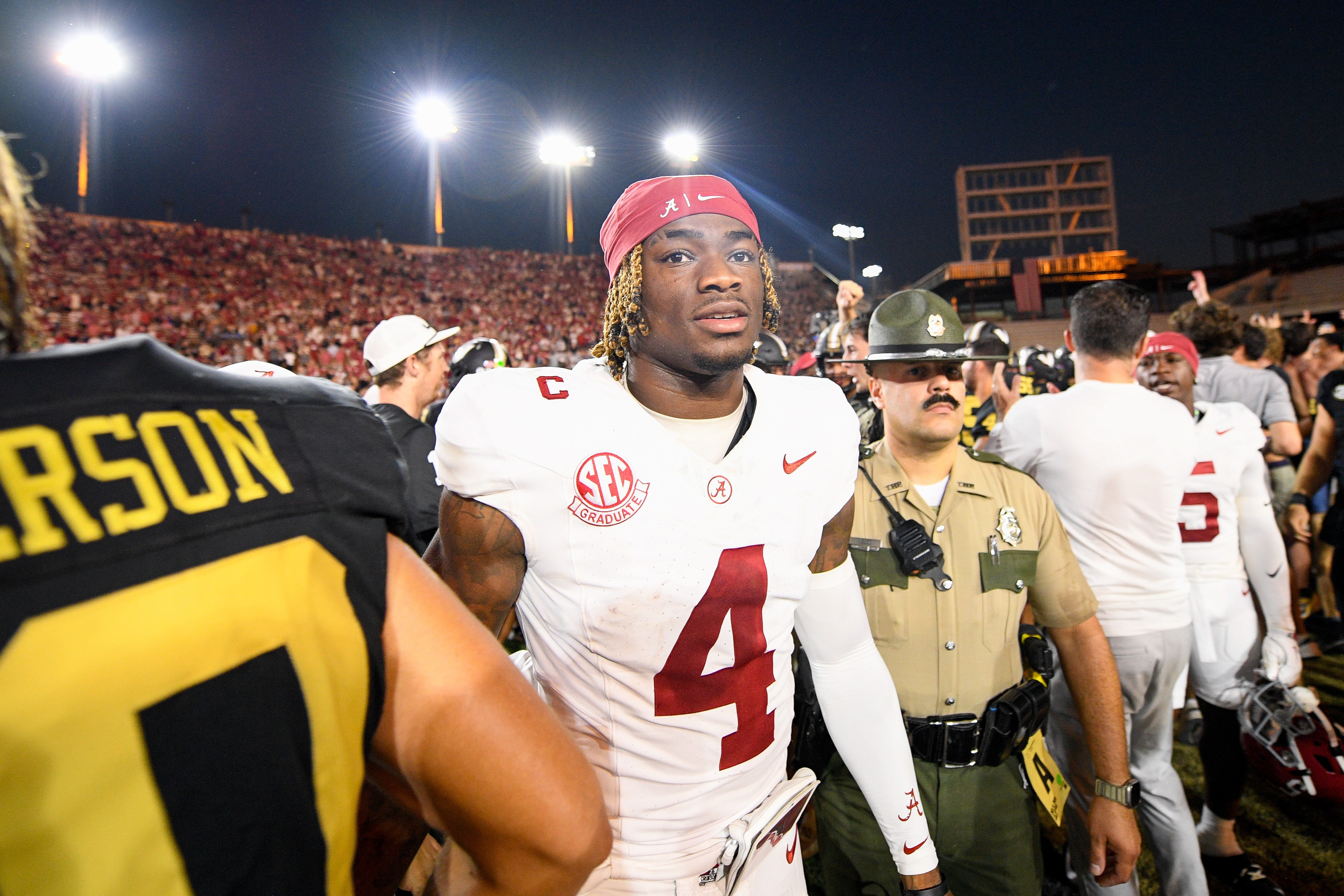 Alabama Crimson Tide quarterback Jalen Milroe (4) shakes hands with Vanderbilt Commodores wide receiver Micah Bell (26) after a game at FirstBank Stadium.