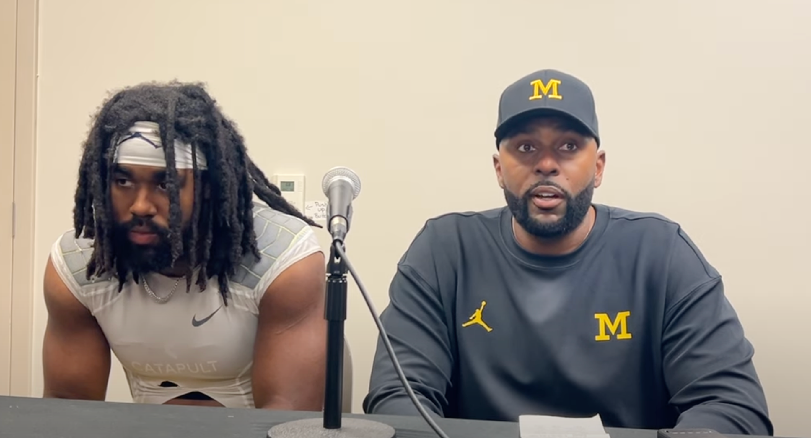 Michigan head coach Sherrone Moore and star running back Donovan Edwards talk with media following loss to Washington
