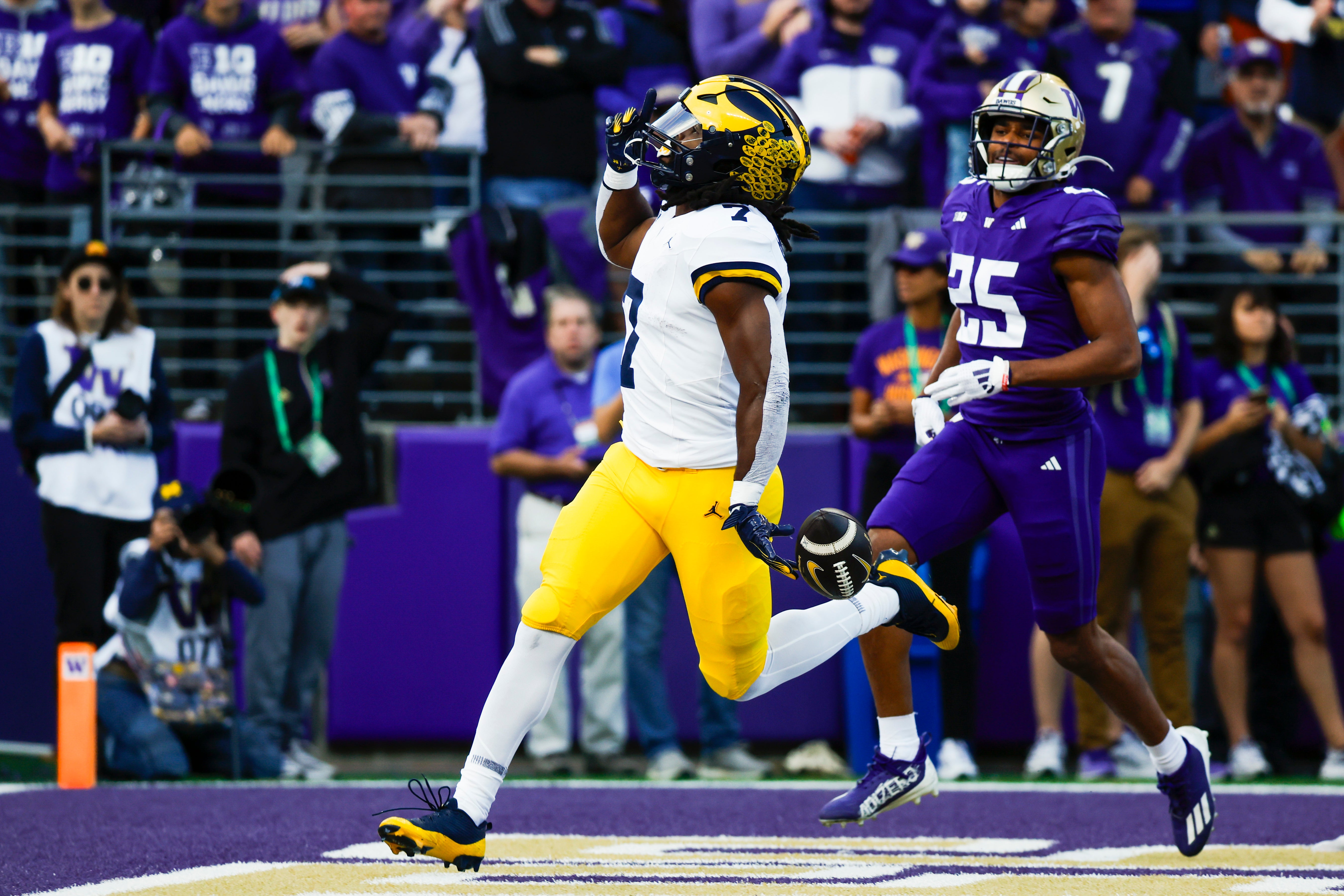 Oct 5, 2024; Seattle, Washington, USA; Michigan Wolverines running back Donovan Edwards (7) rushes for a touchdown against the Washington Huskies during the second quarter at Alaska Airlines Field at Husky Stadium.