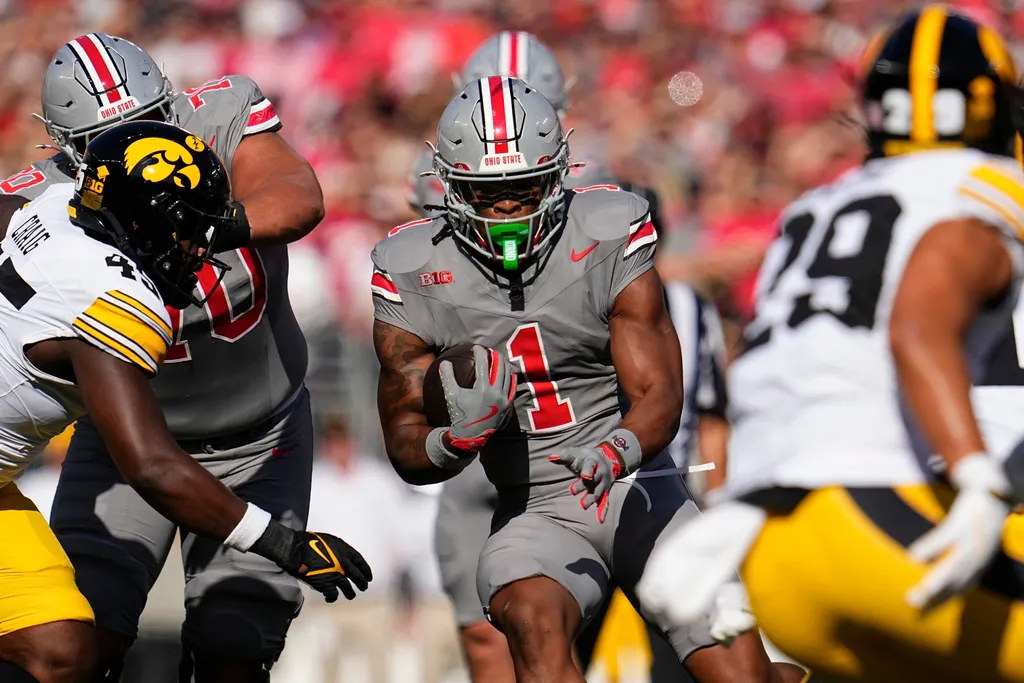 Ohio State Buckeyes running back Quinshon Judkins (1) runs up the middle during the first half of the NCAA football game against the Iowa Hawkeyes at Ohio Stadium