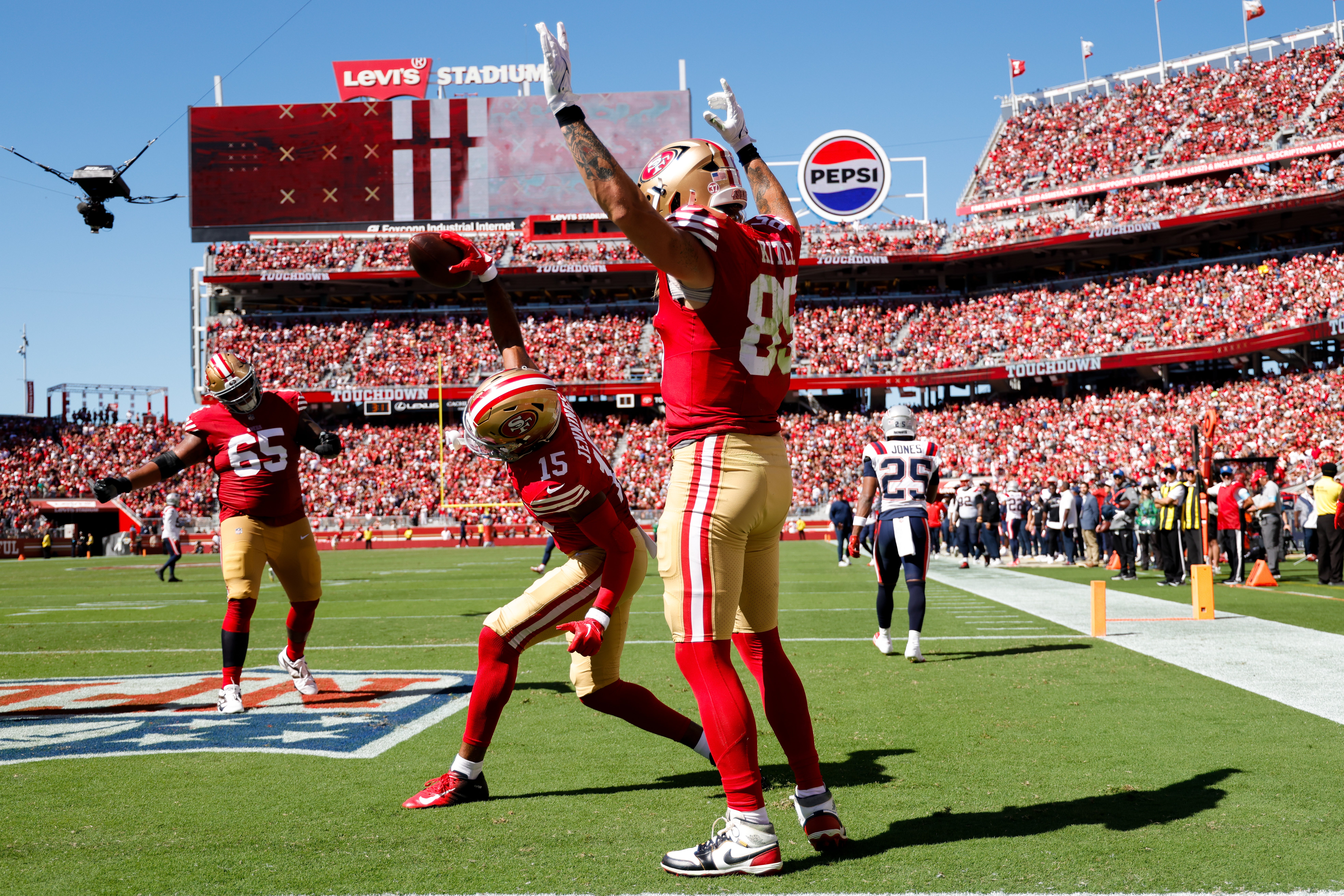 San Francisco 49ers tight end George Kittle (85) celebrates with wide receiver Jauan Jennings (15) after a touchdown against the New England Patriots during the second quarter at Levi's Stadium.