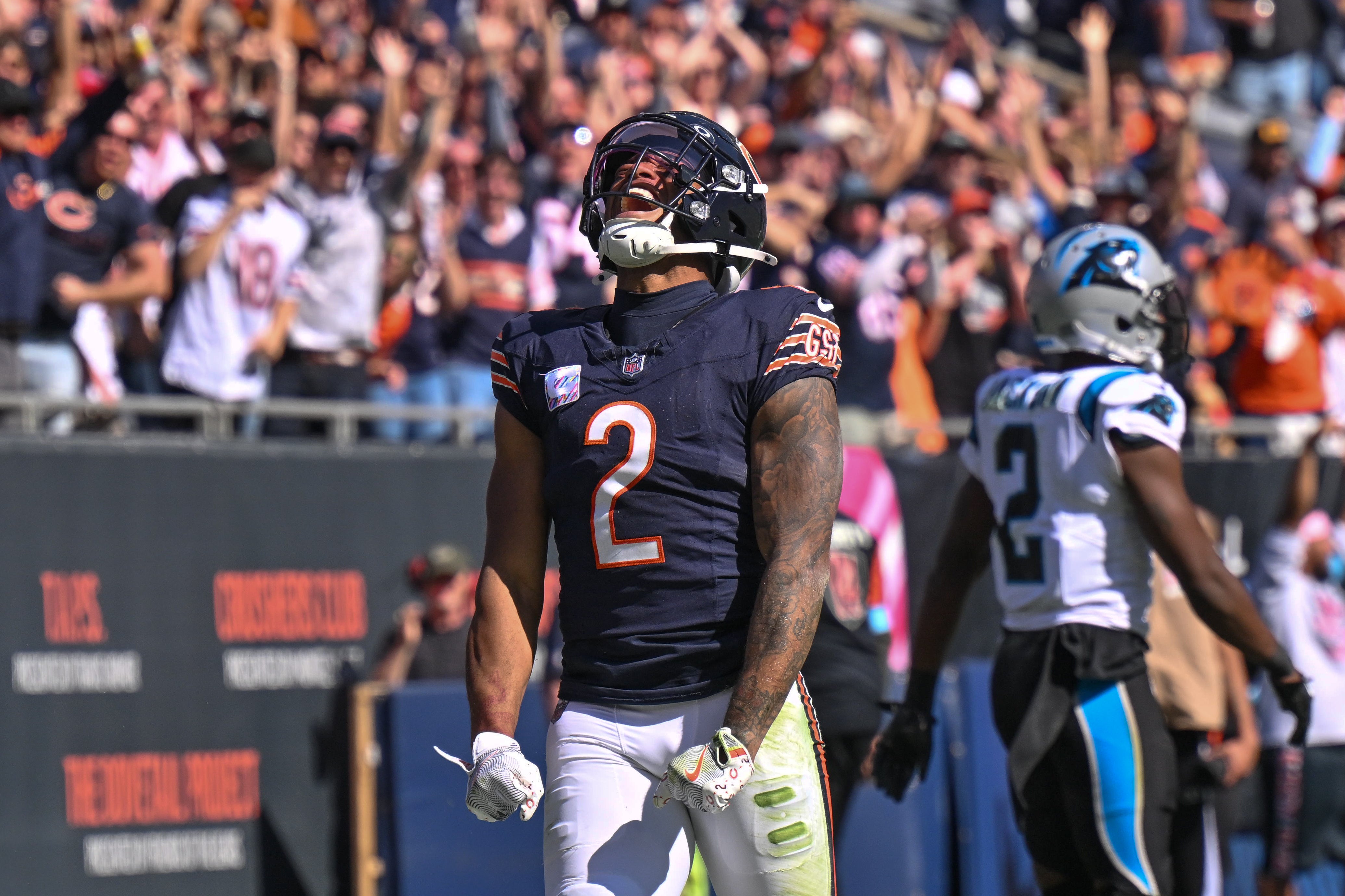 Oct 6, 2024; Chicago, Illinois, USA; Chicago Bears wide receiver DJ Moore (2) celebrates his receiving touchdown against the Carolina Panthers during the second quarter at Soldier Field.