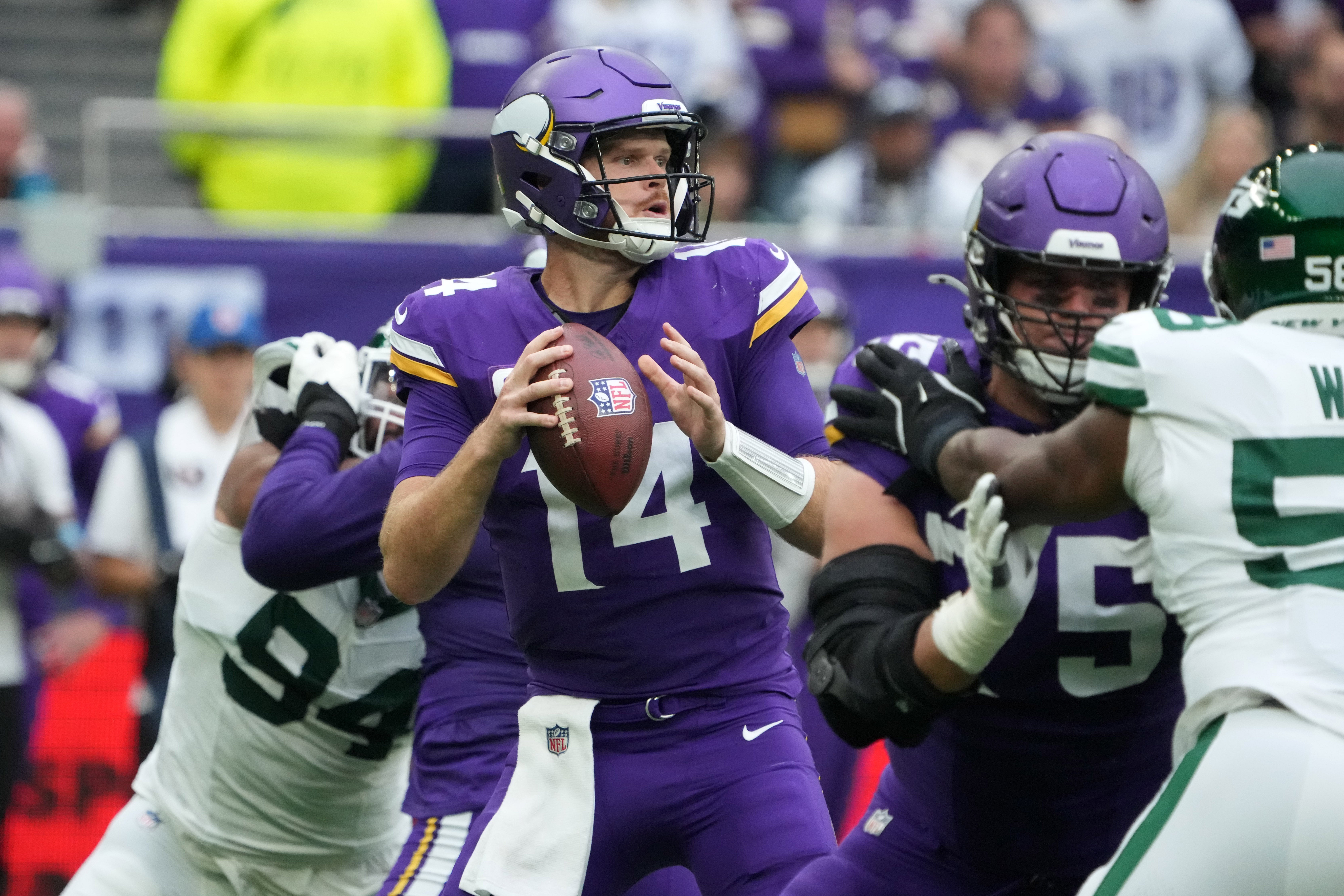 Oct 6, 2024; London, United Kingdom; Minnesota Vikings quarterback Sam Darnold (14) throws the ball against the New York Jets in the first half at Tottenham Hotspur Stadium.