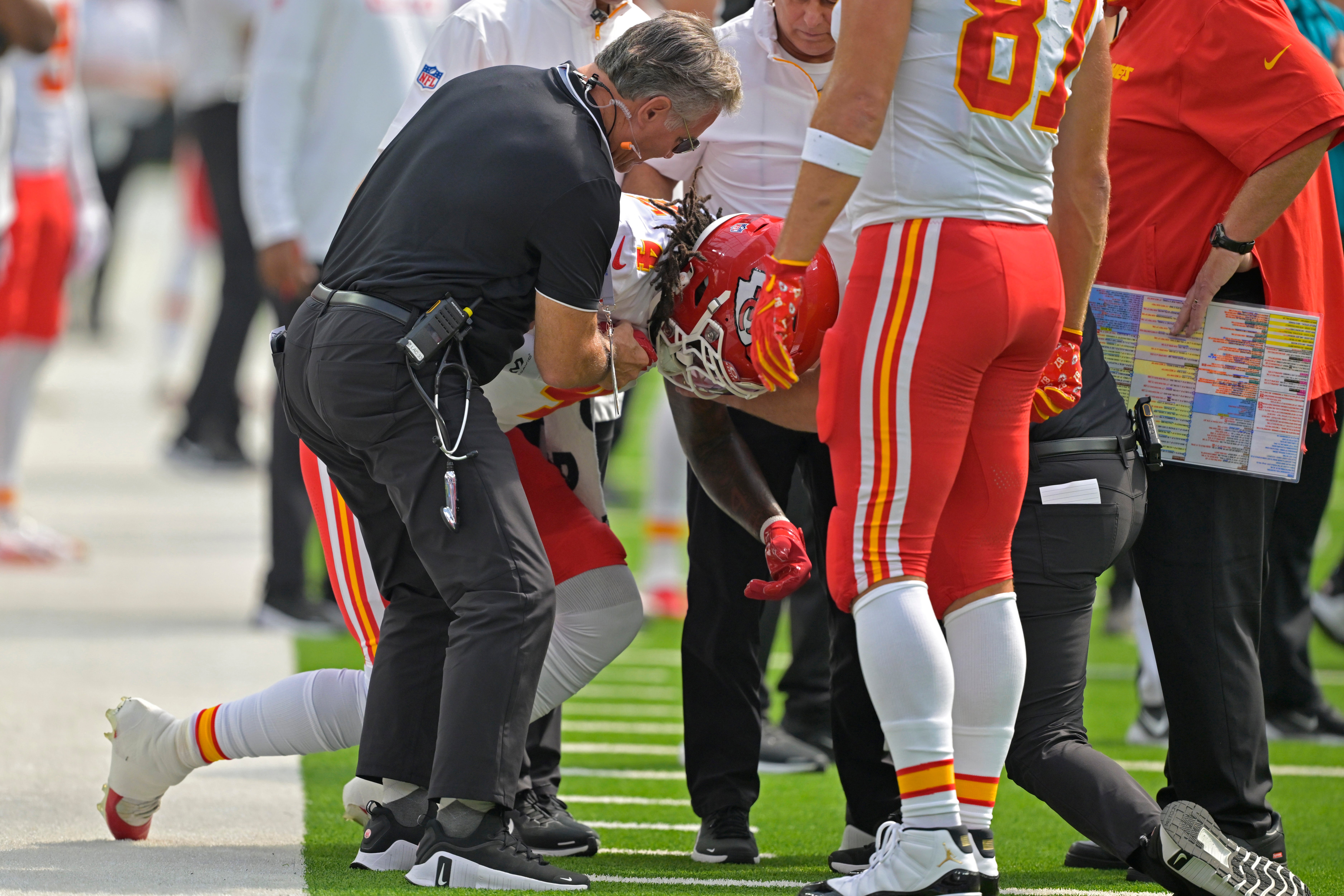 Sep 29, 2024; Inglewood, California, USA; Kansas City Chiefs wide receiver Rashee Rice (4) is assisted by medical staff after an injury in the first half against the Los Angeles Chargers at SoFi Stadium.