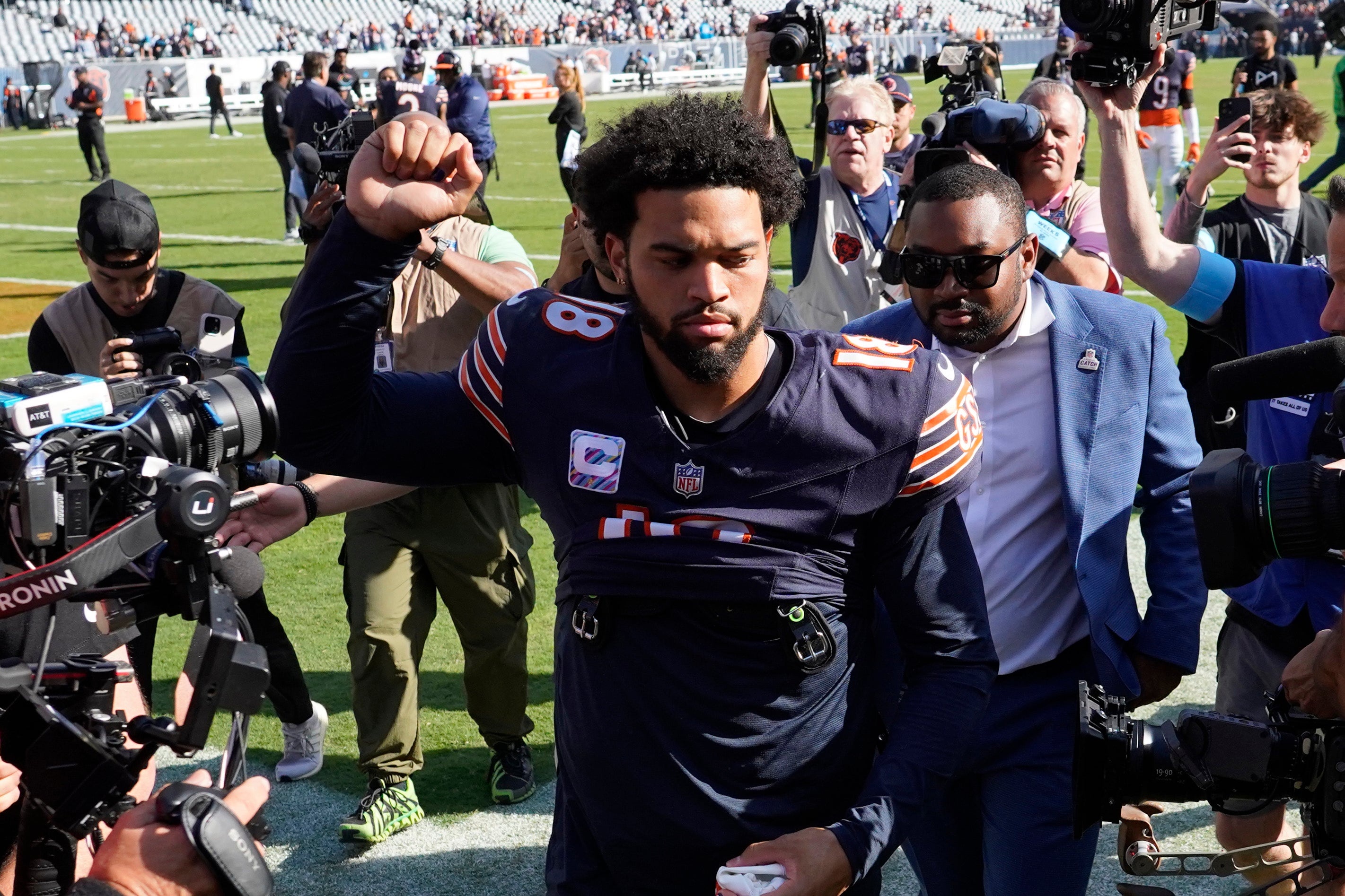 Oct 6, 2024; Chicago, Illinois, USA; Chicago Bears quarterback Caleb Williams (18) gestures to the crowd after the game against the Carolina Panthers at Soldier Field.