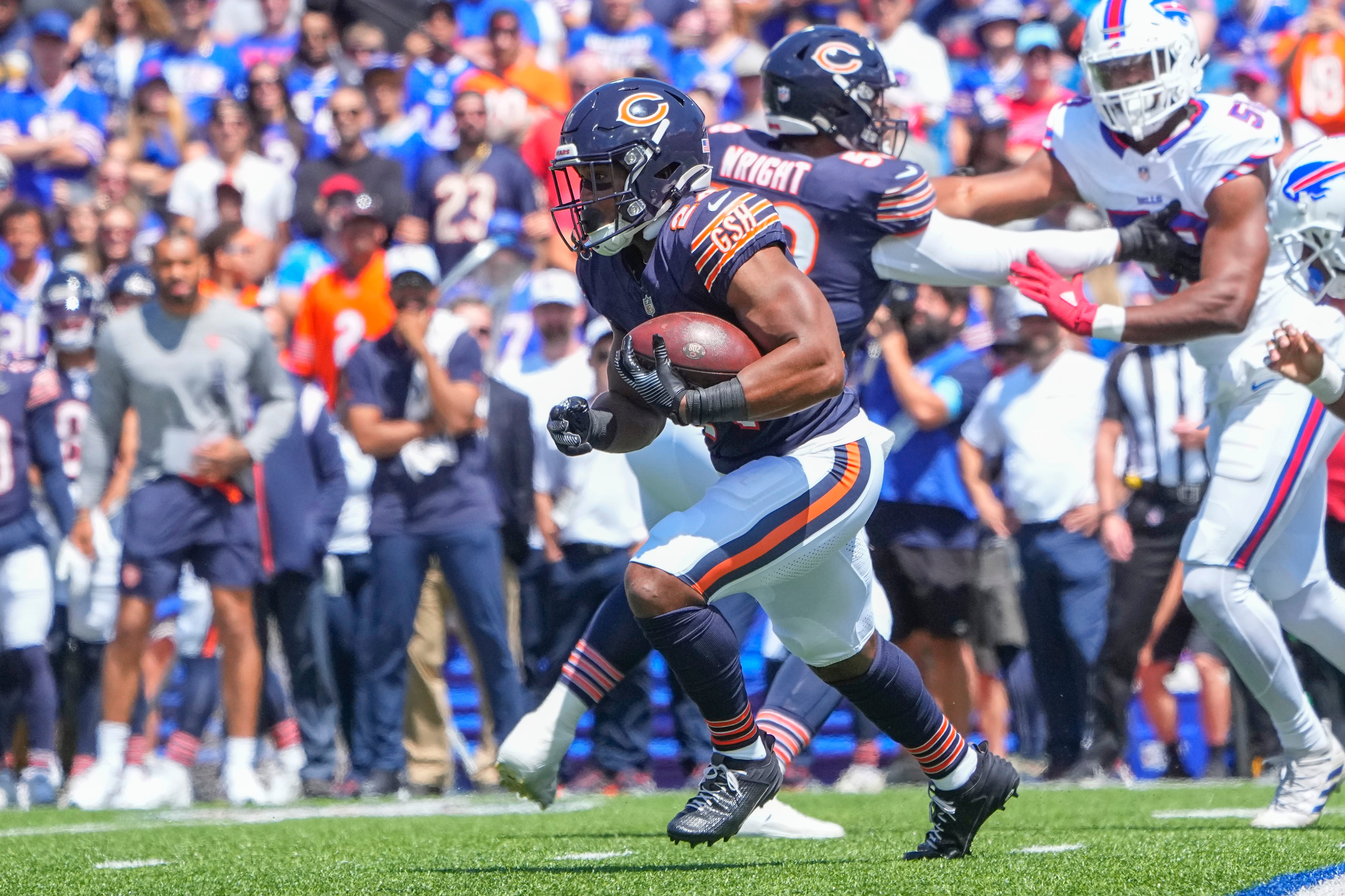 Aug 10, 2024; Orchard Park, New York, USA; Chicago Bears running back Khalil Herbert (24) runs with the ball against the Buffalo Bills during the first half at Highmark Stadium.
