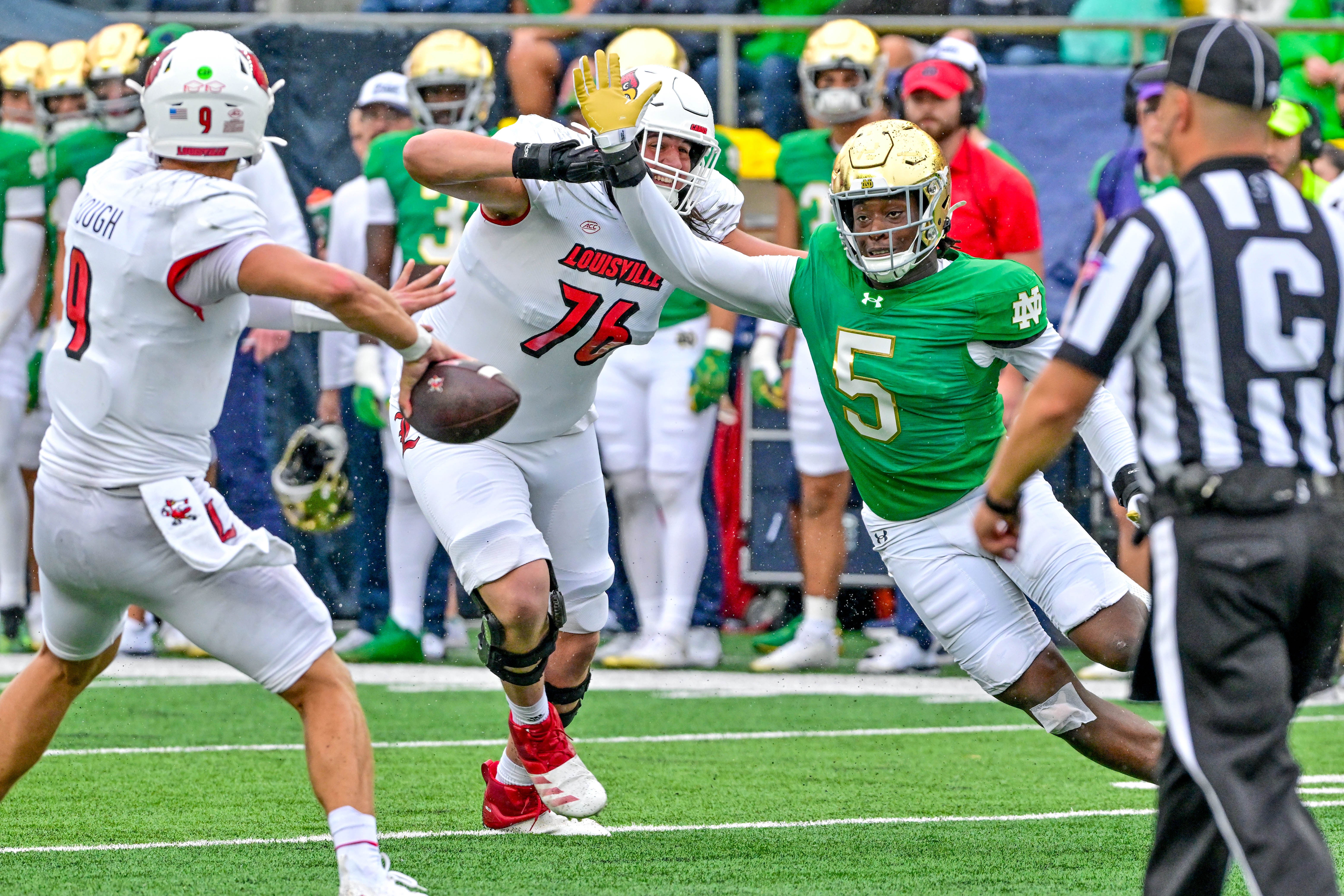 Notre Dame Fighting Irish defenisve lineman Boubacar Traore (5) pressures Louisville Cardinals quarterback Tyler Shough (9) in the first quarter at Notre Dame Stadium.