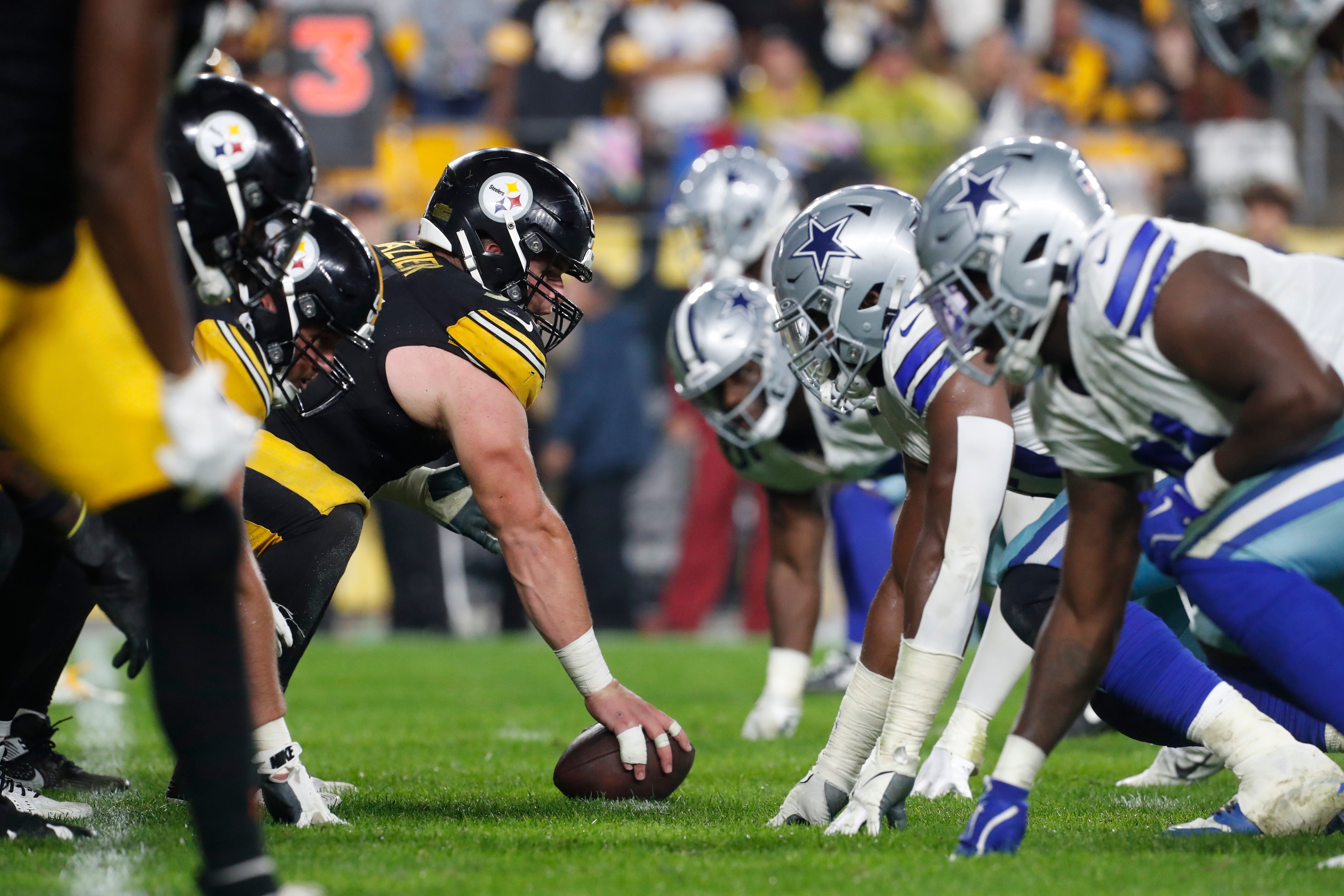 Pittsburgh Steelers center Zach Frazier (54) prepares to snap the ball against the Dallas Cowboys defense during the second quarter at Acrisure Stadium. Dallas won 20-17.