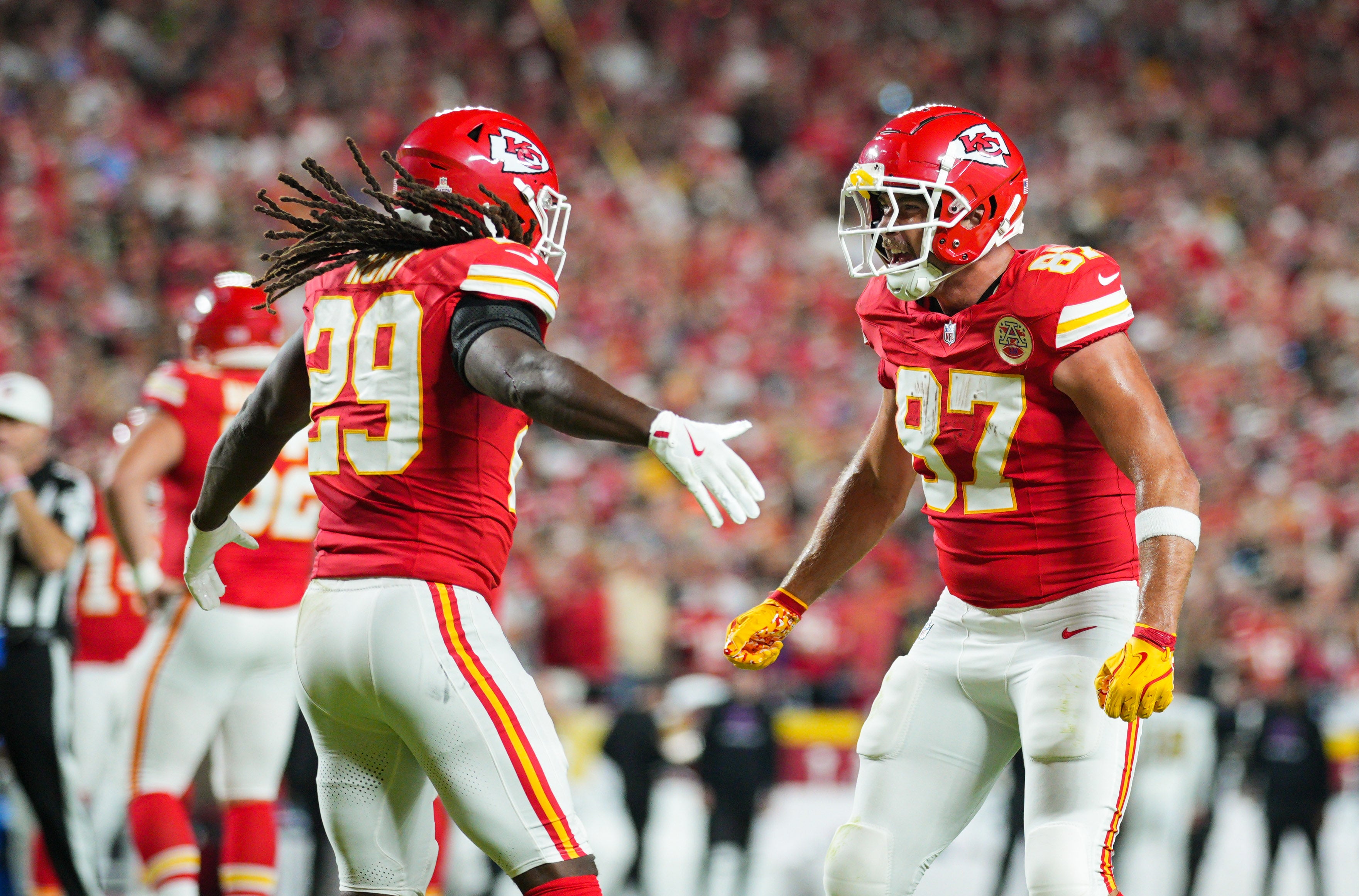 Oct 7, 2024; Kansas City, Missouri, USA; Kansas City Chiefs running back Kareem Hunt (29) celebrates with tight end Travis Kelce (87) after scoring a touchdown during the first half against the New Orleans Saints at GEHA Field at Arrowhead Stadium