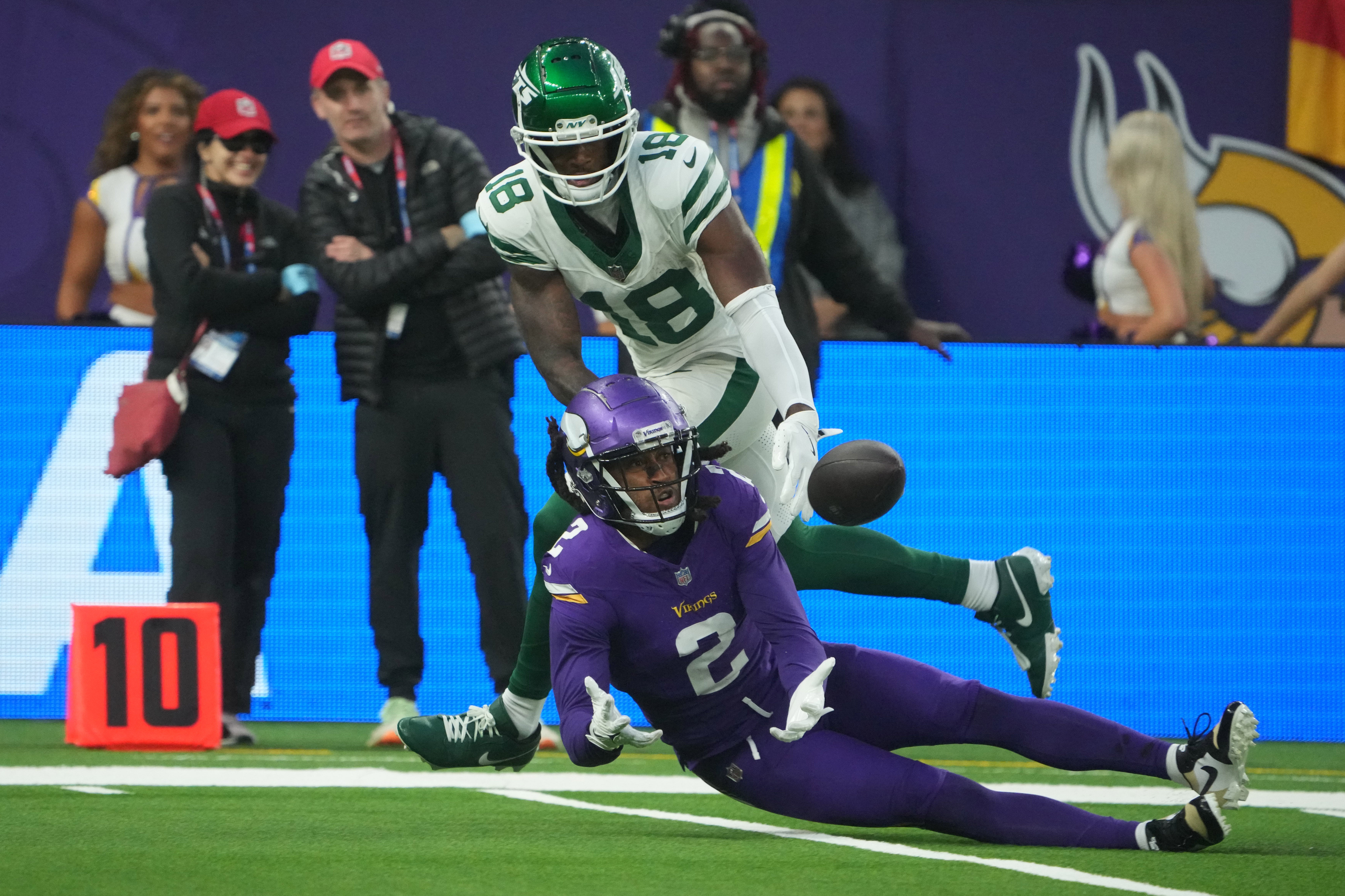 Oct 6, 2024; London, United Kingdom; Minnesota Vikings cornerback Stephon Gilmore (2) intercepts a pass intended for New York Jets wide receiver Mike Williams (18) in the fourth quarter at Tottenham Hotspur Stadium.