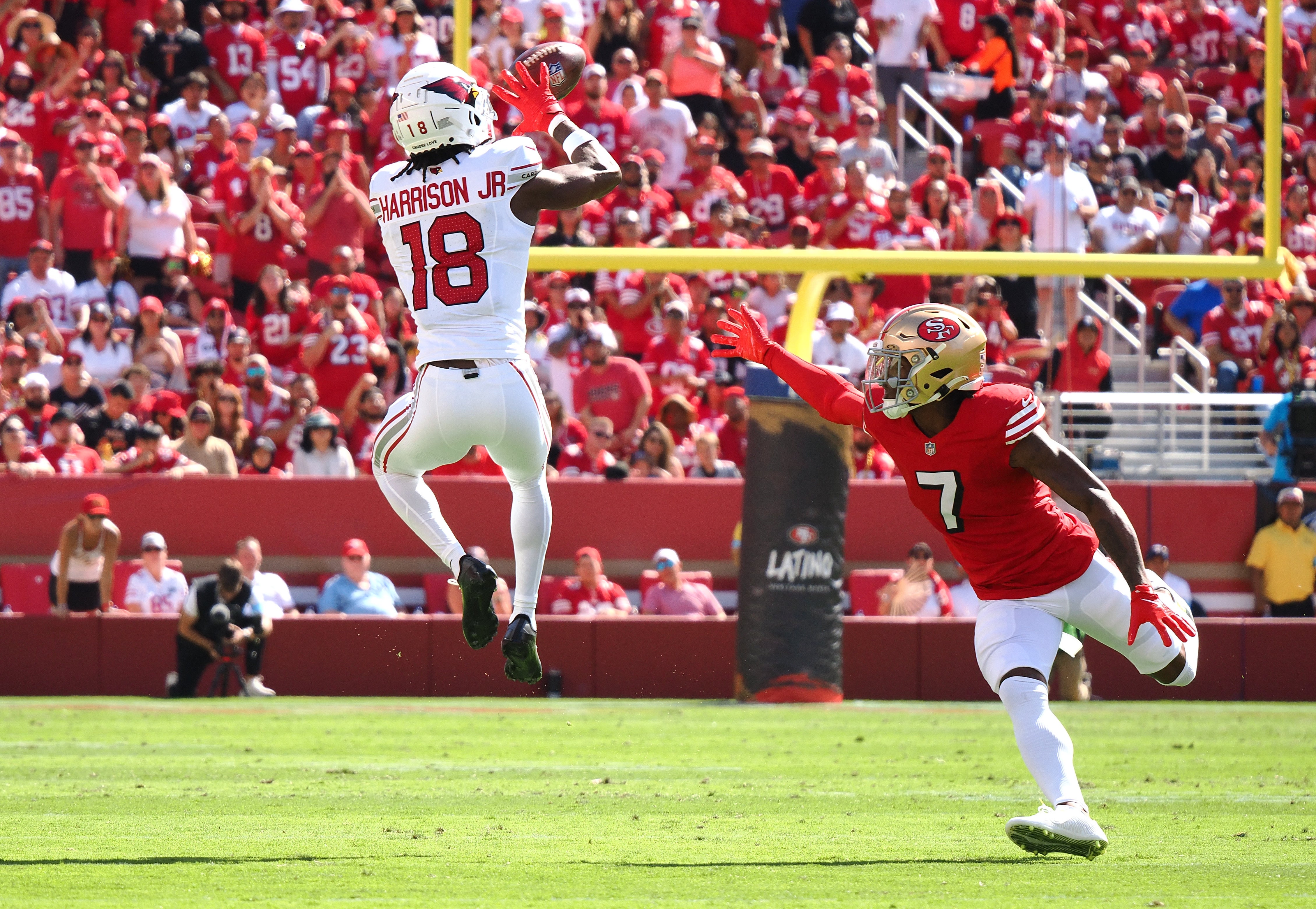 Arizona Cardinals wide receiver Marvin Harrison Jr (18) catches the ball above San Francisco 49ers cornerback Charvarius Ward (7) during the first quarter at Levi's Stadium.
