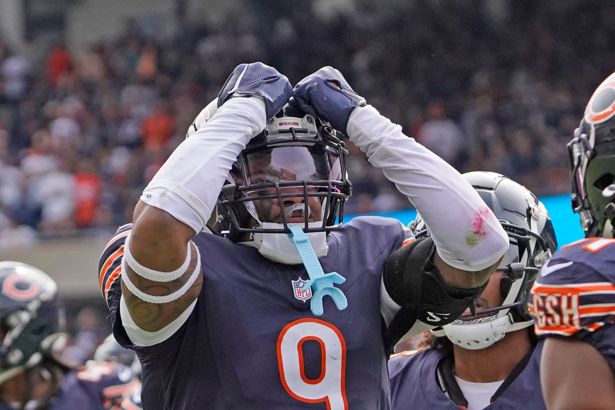 Sep 29, 2024; Chicago, Illinois, USA; Chicago Bears safety Jaquan Brisker (9) celebrates a defensive stop against the Los Angeles Rams during the second half at Soldier Field.