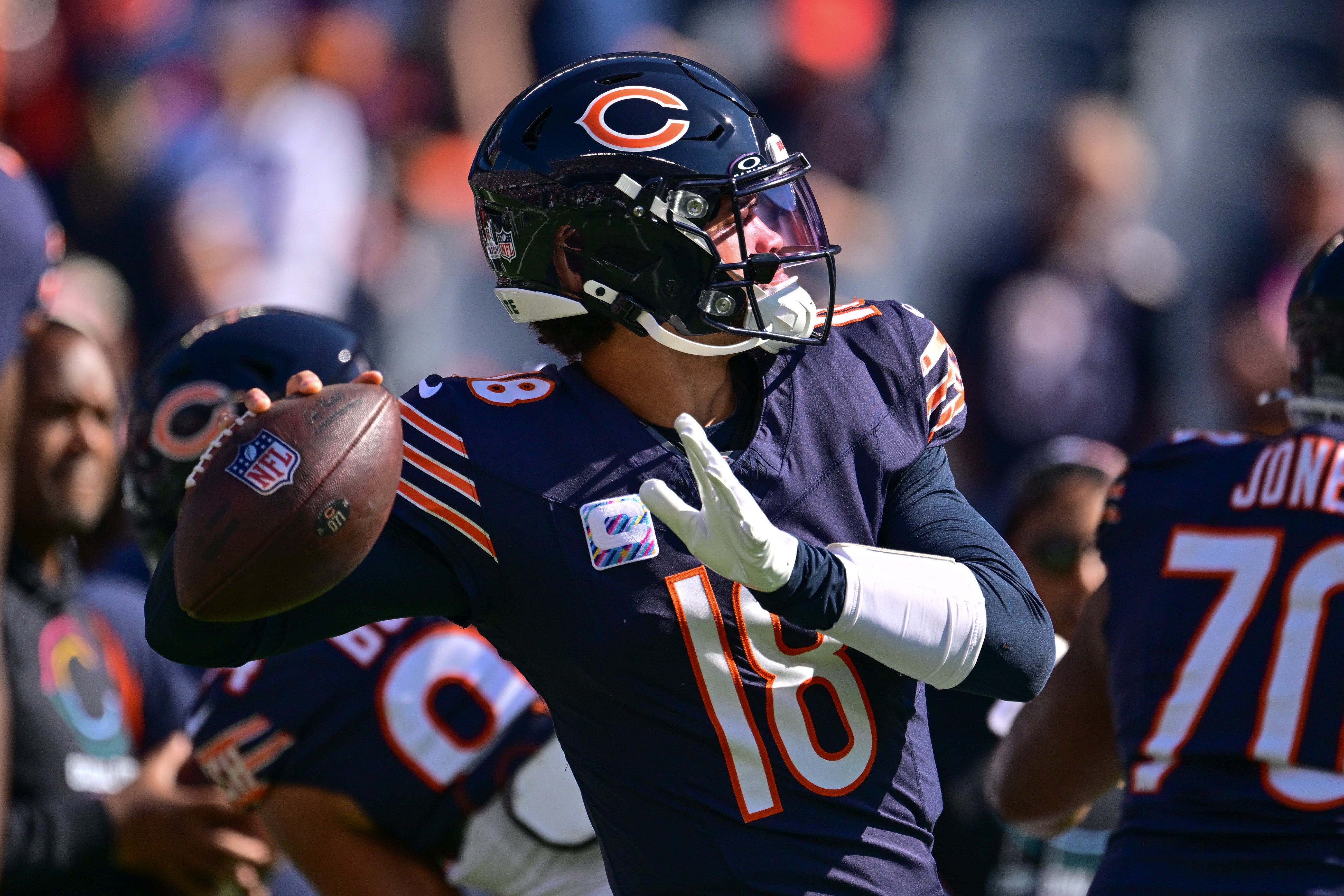 Oct 6, 2024; Chicago, Illinois, USA; Chicago Bears quarterback Caleb Williams (18) warms up before the game against the Carolina Panthers at Soldier Field.