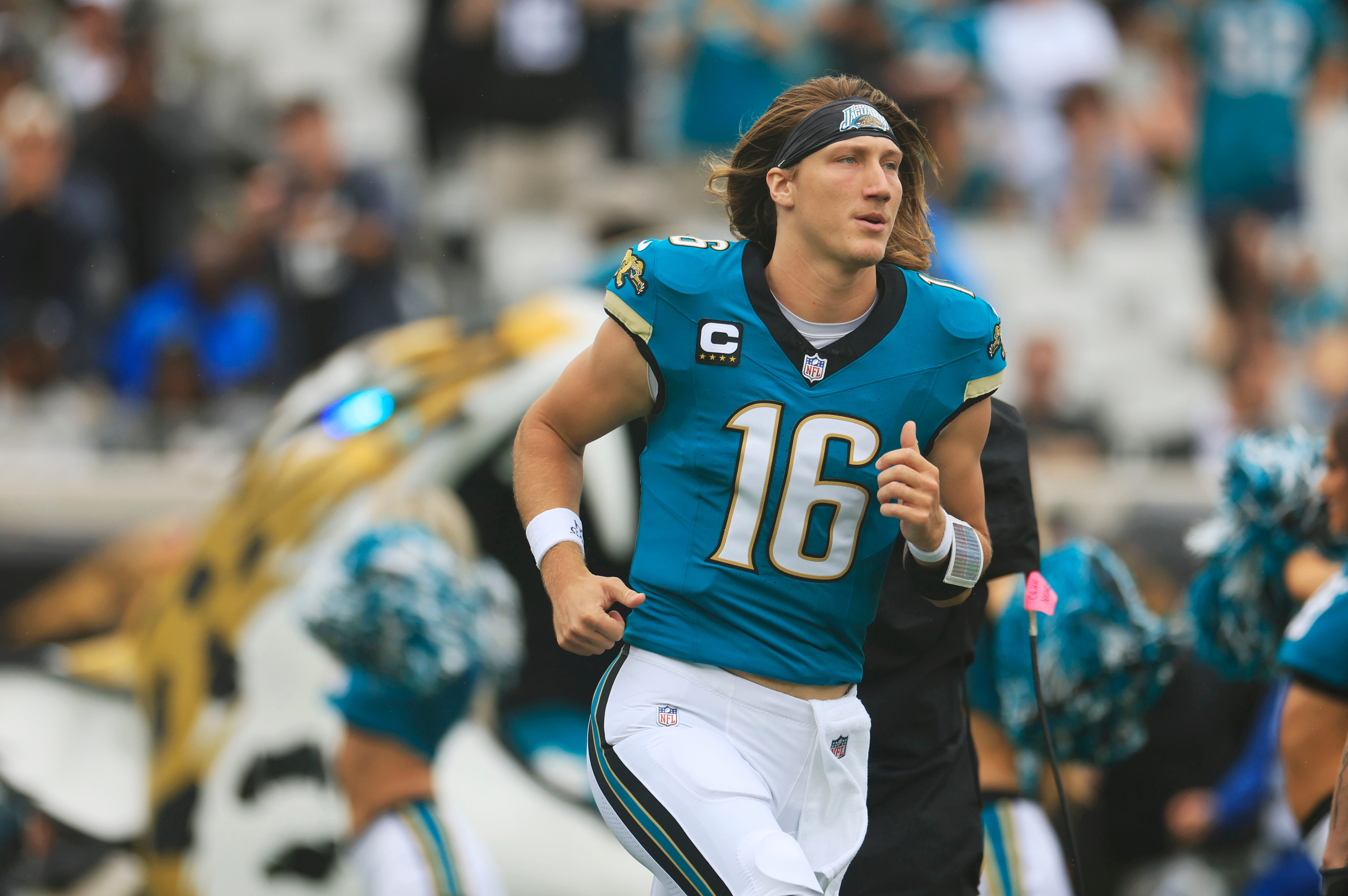 Jacksonville Jaguars quarterback Trevor Lawrence (16) runs on the field before an NFL football matchup Sunday, Oct. 6, 2024 at EverBank Stadium in Jacksonville, Fla. The Jaguars edged the Colts on a field goal 37-34.