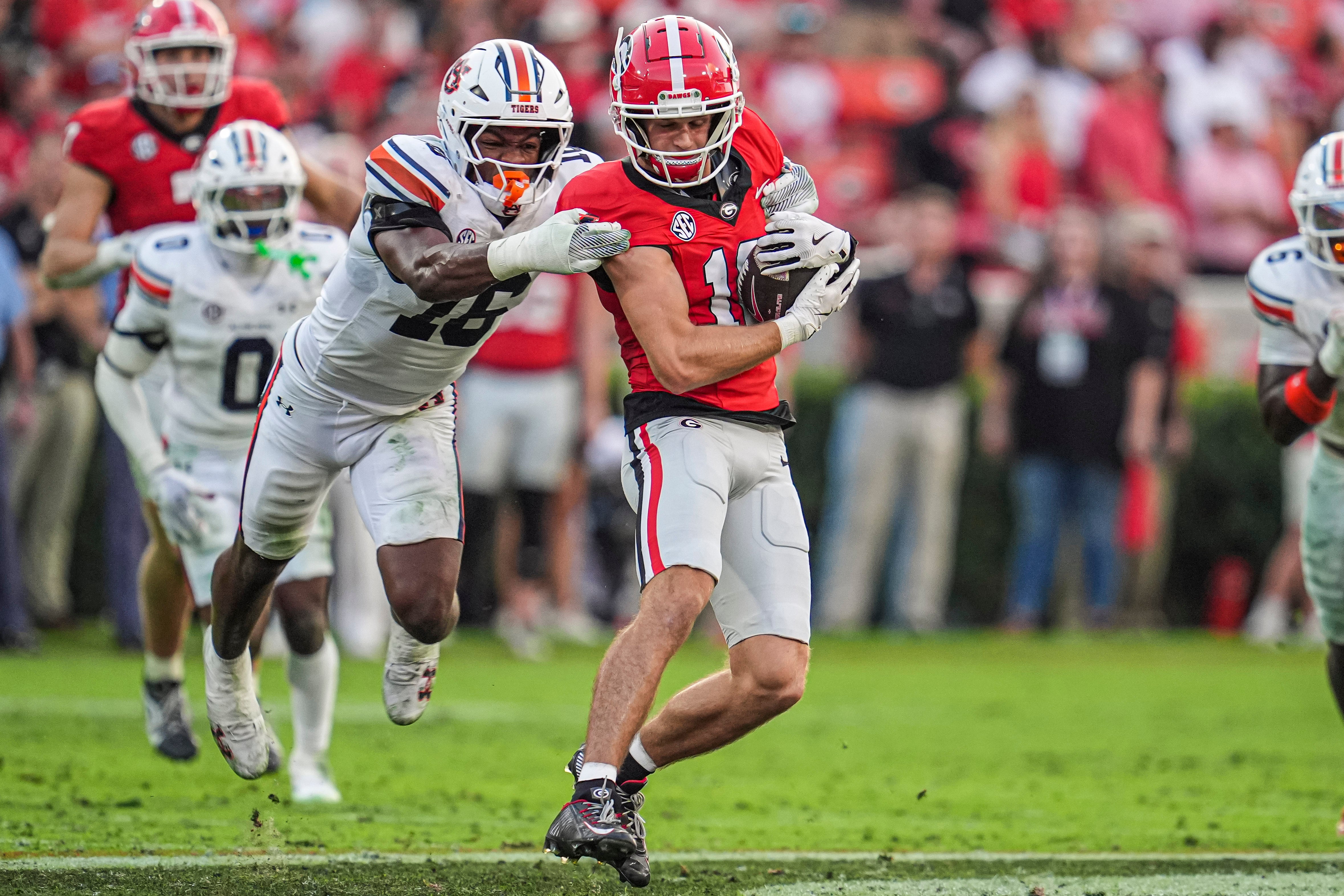 Georgia Bulldogs wide receiver London Humphreys (16) makes a catch behind Auburn Tigers linebacker Demarcus Riddick (16) during the second half at Sanford Stadium.