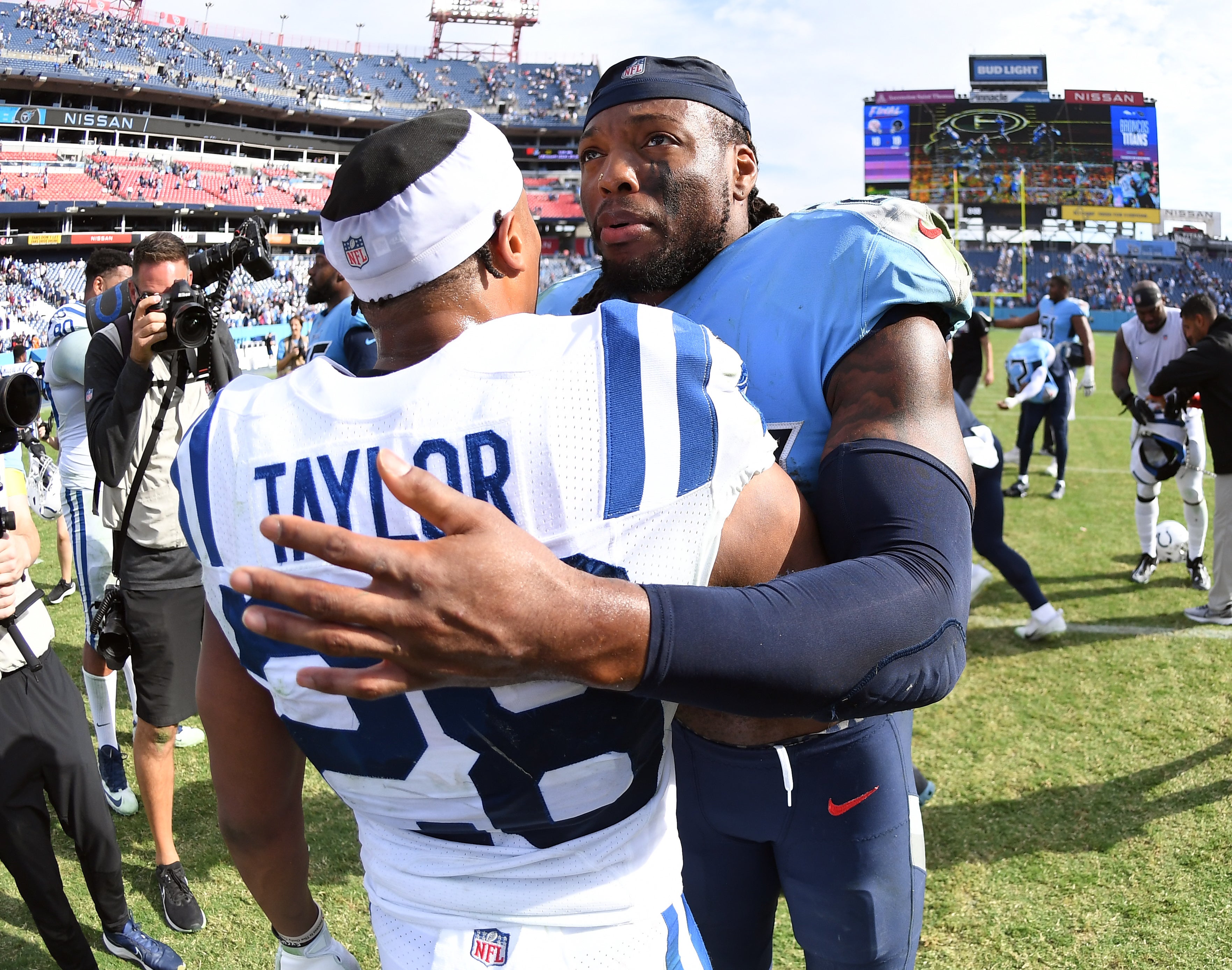 Oct 23, 2022; Nashville, Tennessee, USA; Tennessee Titans running back Derrick Henry (22) talks with Indianapolis Colts running back Jonathan Taylor (28) after a Titans win at Nissan Stadium.