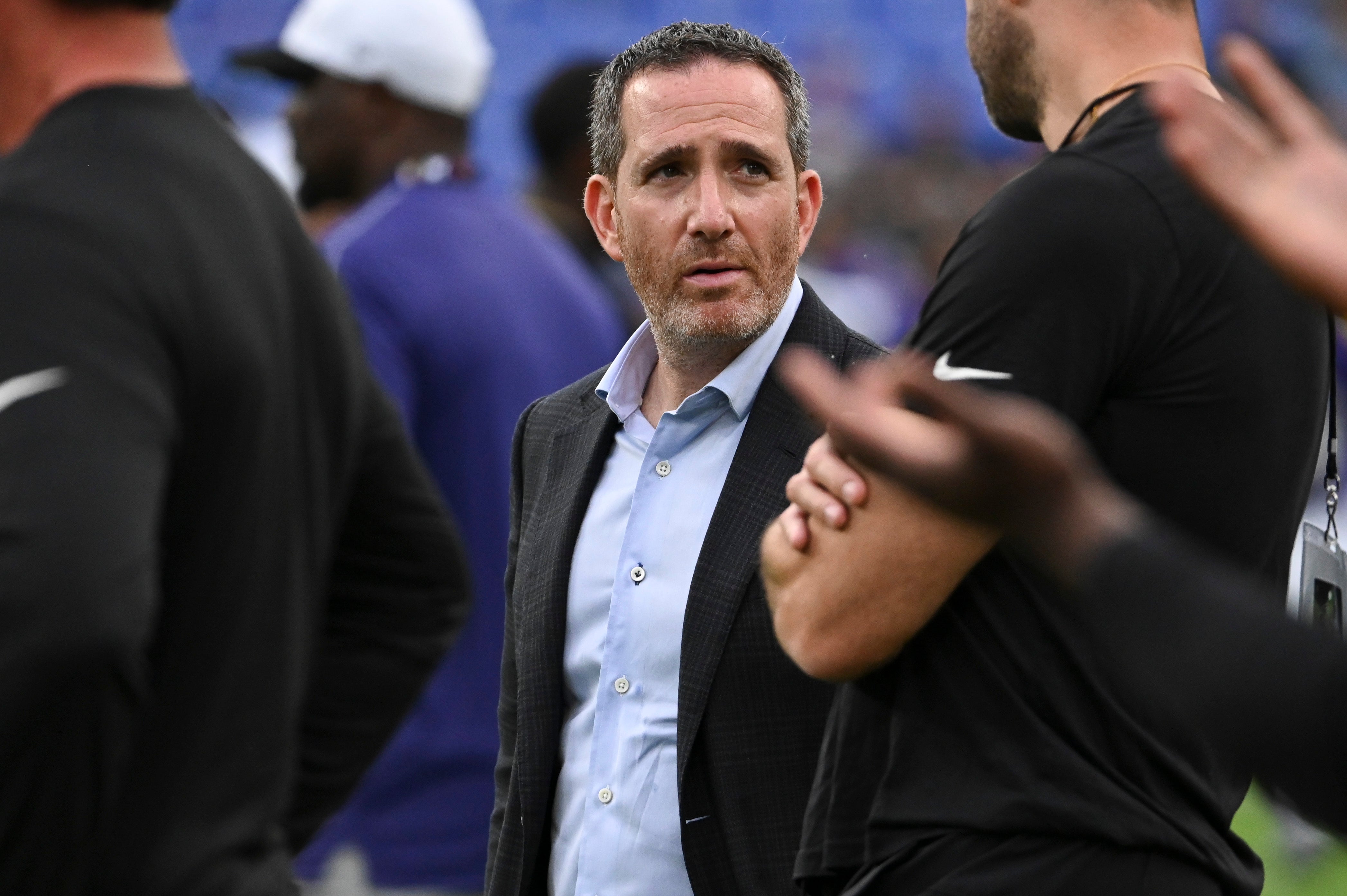 Philadelphia Eagles general manager Howie Roseman stands on the field before a preseason game against the Baltimore Ravens at M&T Bank Stadium.