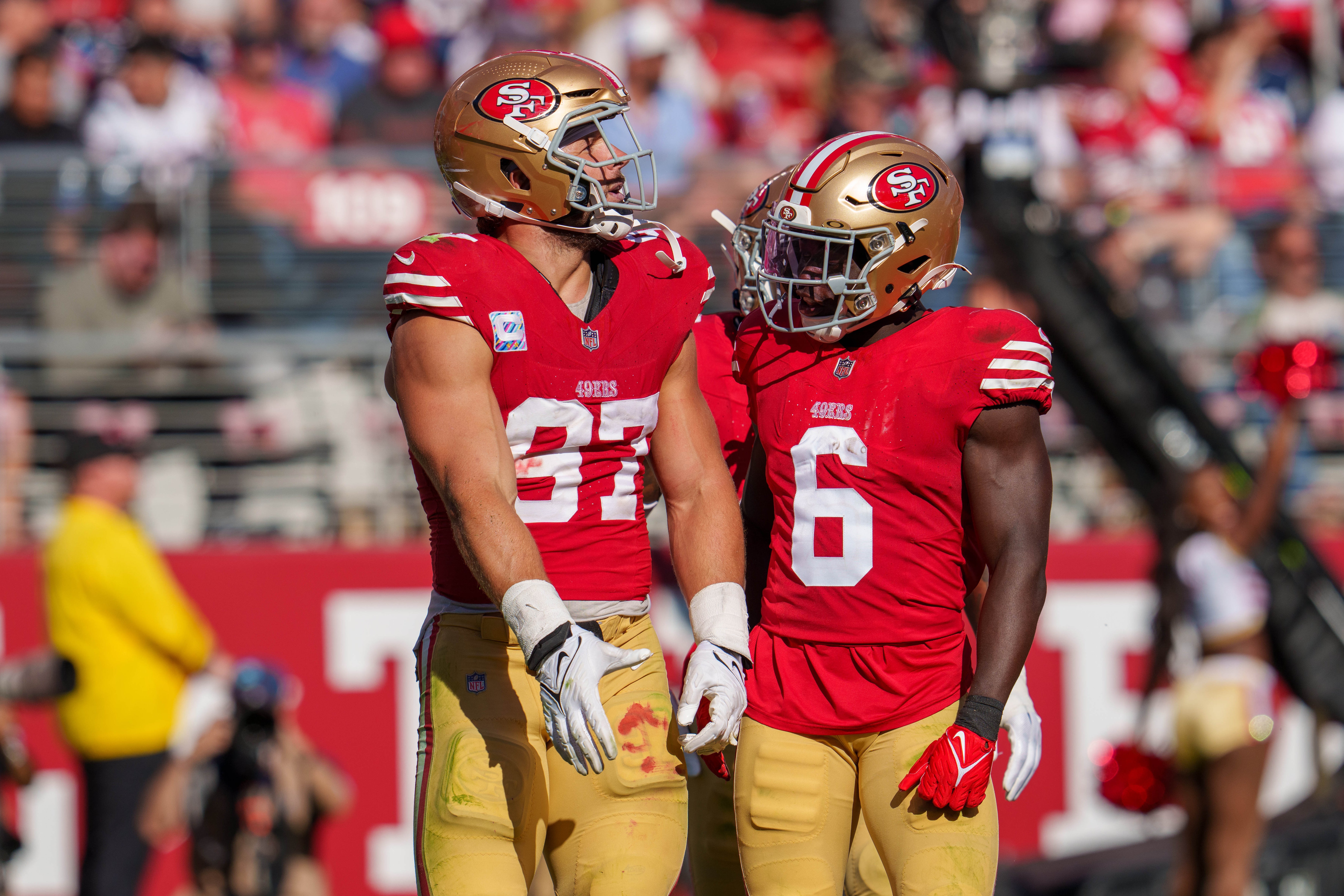 San Francisco 49ers defensive end Nick Bosa (97) and San Francisco 49ers safety Malik Mustapha (6) celebrate after the sack against the New England Patriots during the fourth quarter at Levi's Stadium.