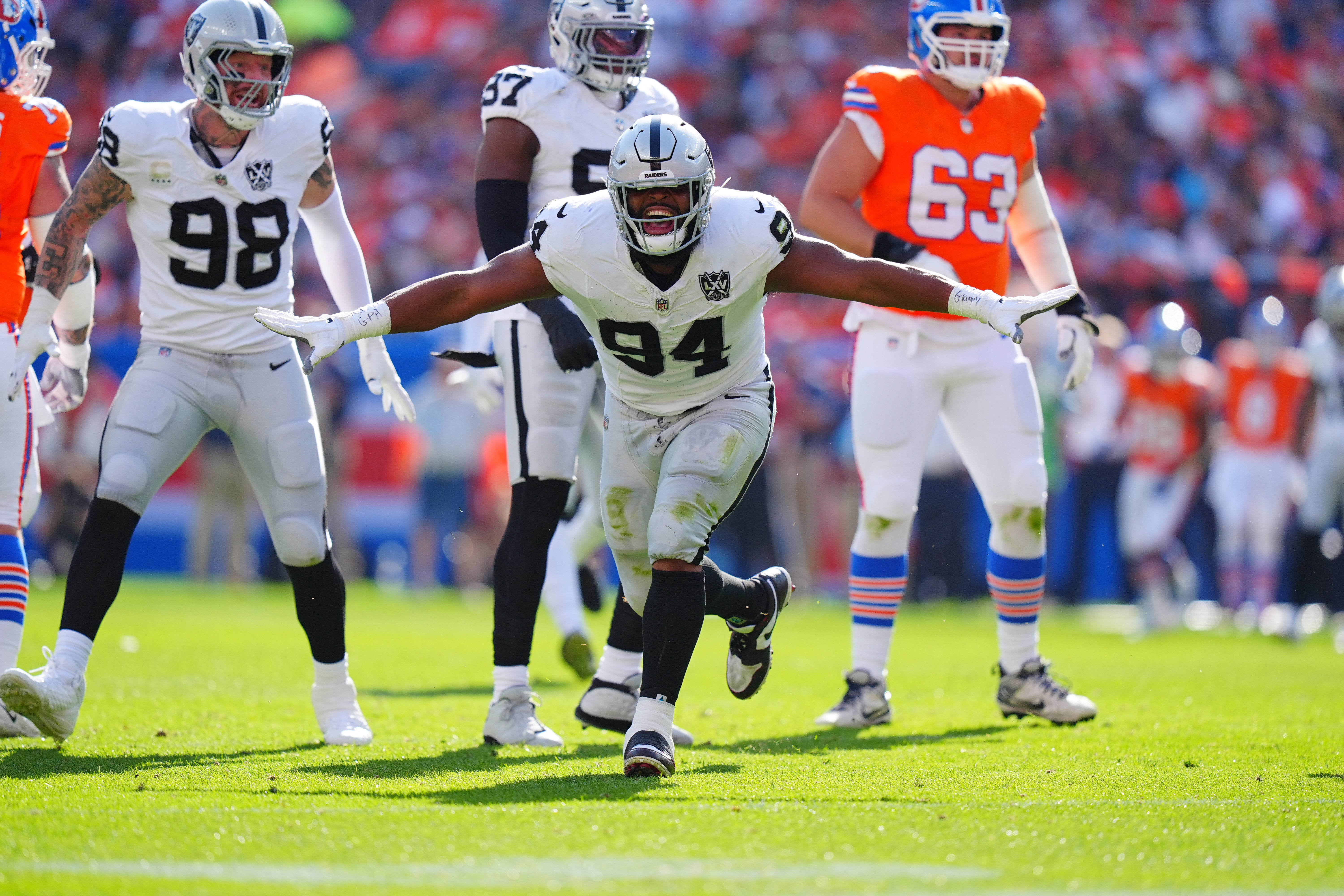 Oct 6, 2024; Denver, Colorado, USA; Las Vegas Raiders defensive tackle Christian Wilkins (94) celebrates his sack in the second quarter against the Denver Broncos at Empower Field at Mile High.