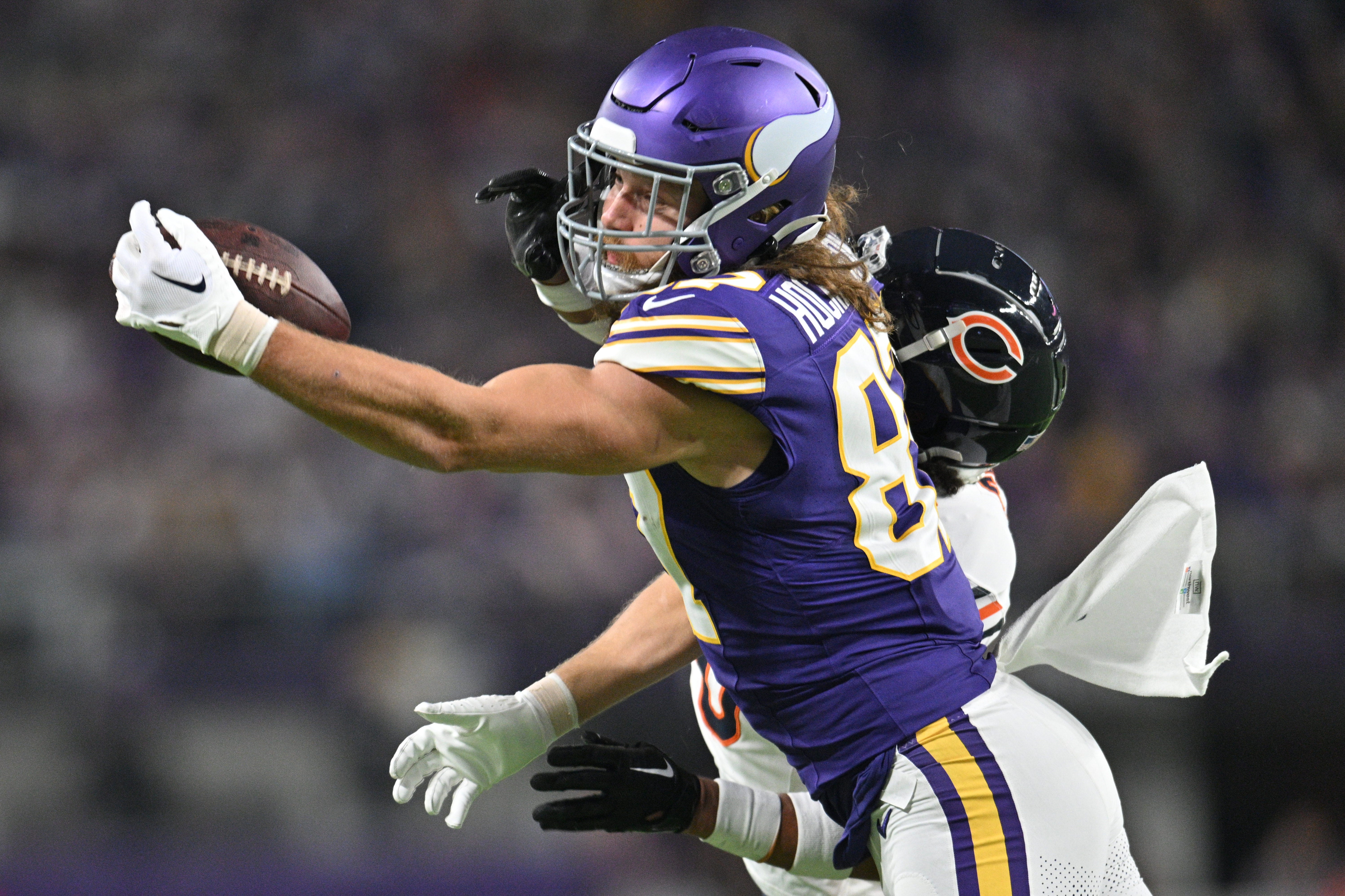 Nov 27, 2023; Minneapolis, Minnesota, USA; Minnesota Vikings tight end T.J. Hockenson (87) drops a pass during the second quarter as Chicago Bears cornerback Kyler Gordon (6) defends at U.S. Bank Stadium.