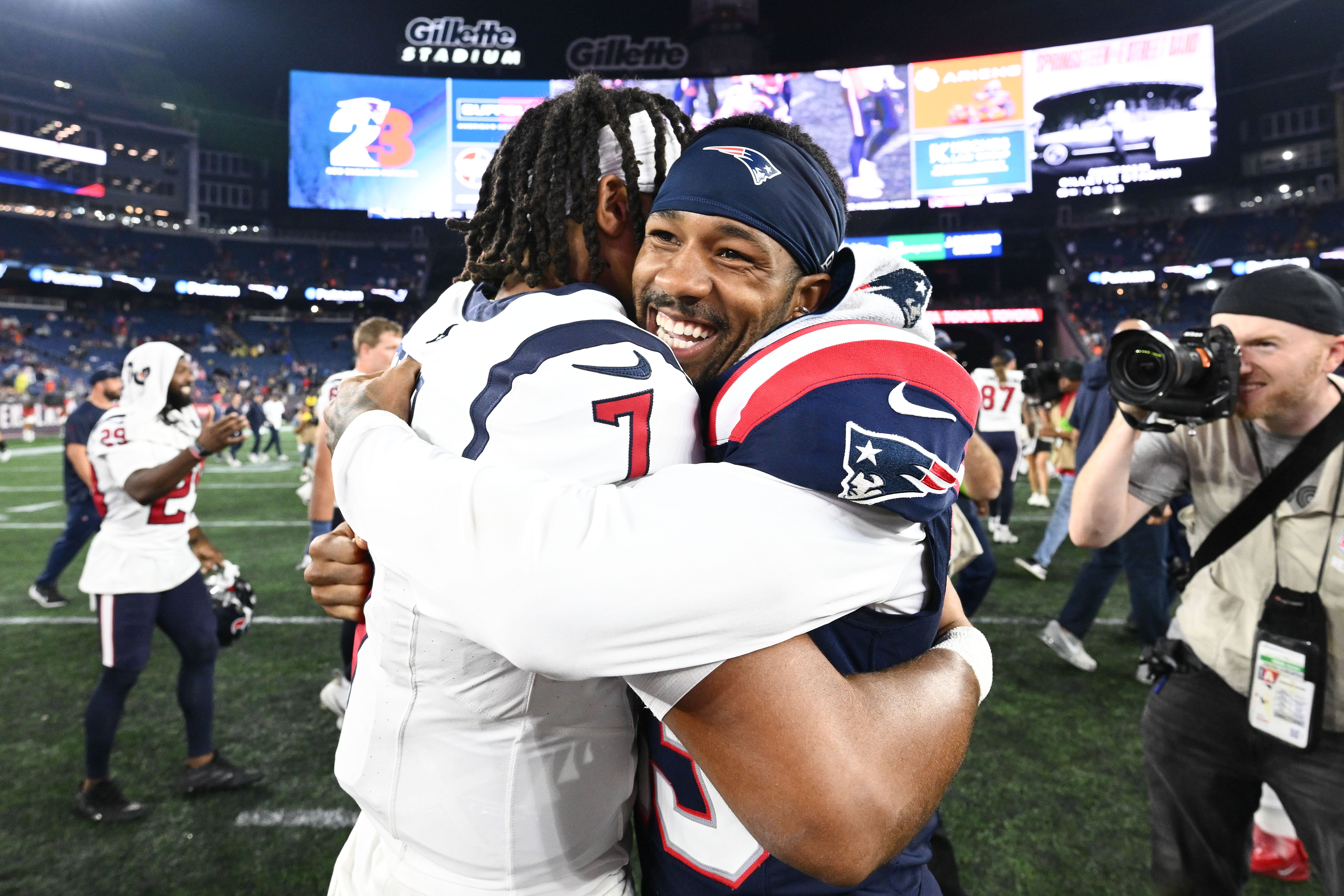 Aug 10, 2023; Foxborough, Massachusetts, USA; Houston Texans quarterback C.J. Stroud (7) hugs New England Patriots cornerback Jack Jones (13) after a game at Gillette Stadium.