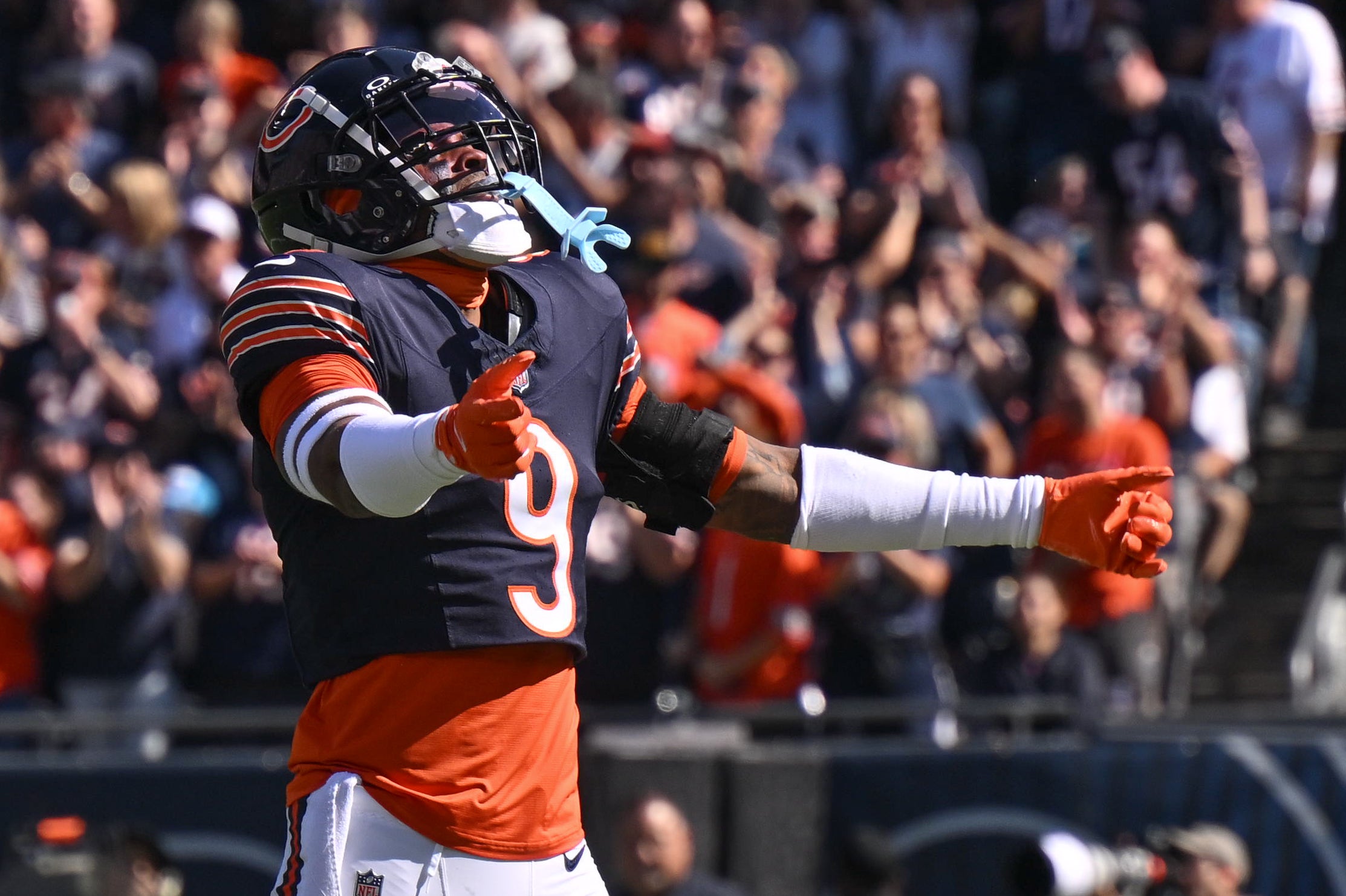 Oct 6, 2024; Chicago, Illinois, USA; Chicago Bears safety Jaquan Brisker (9) celebrates a defensive stop against the Carolina Panthers during the first quarter at Soldier Field.