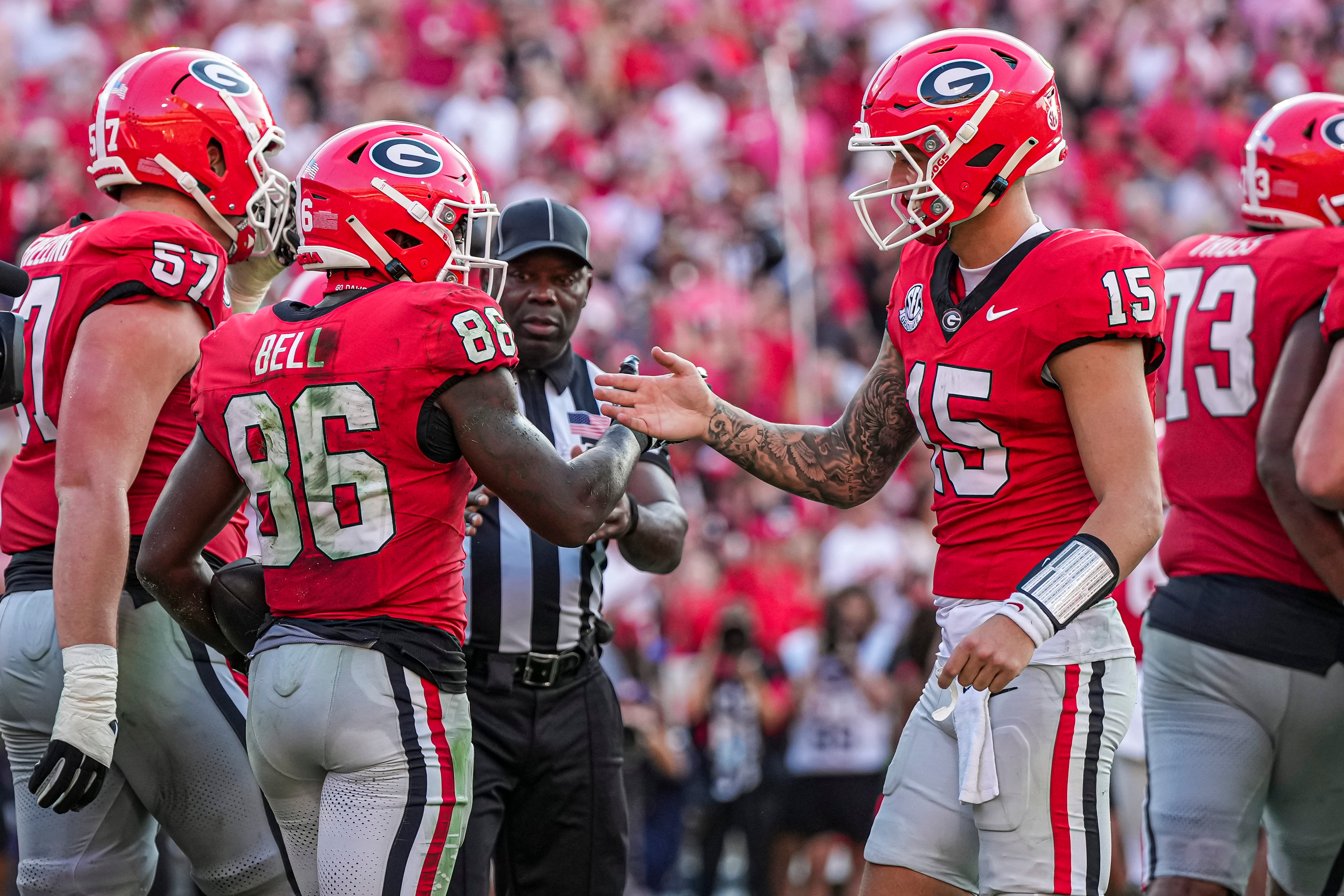 Georgia Bulldogs wide receiver Dillon Bell (86) reacts with quarterback Carson Beck (15) after catching a touchdown pass against the Auburn Tigers during the second half at Sanford Stadium.