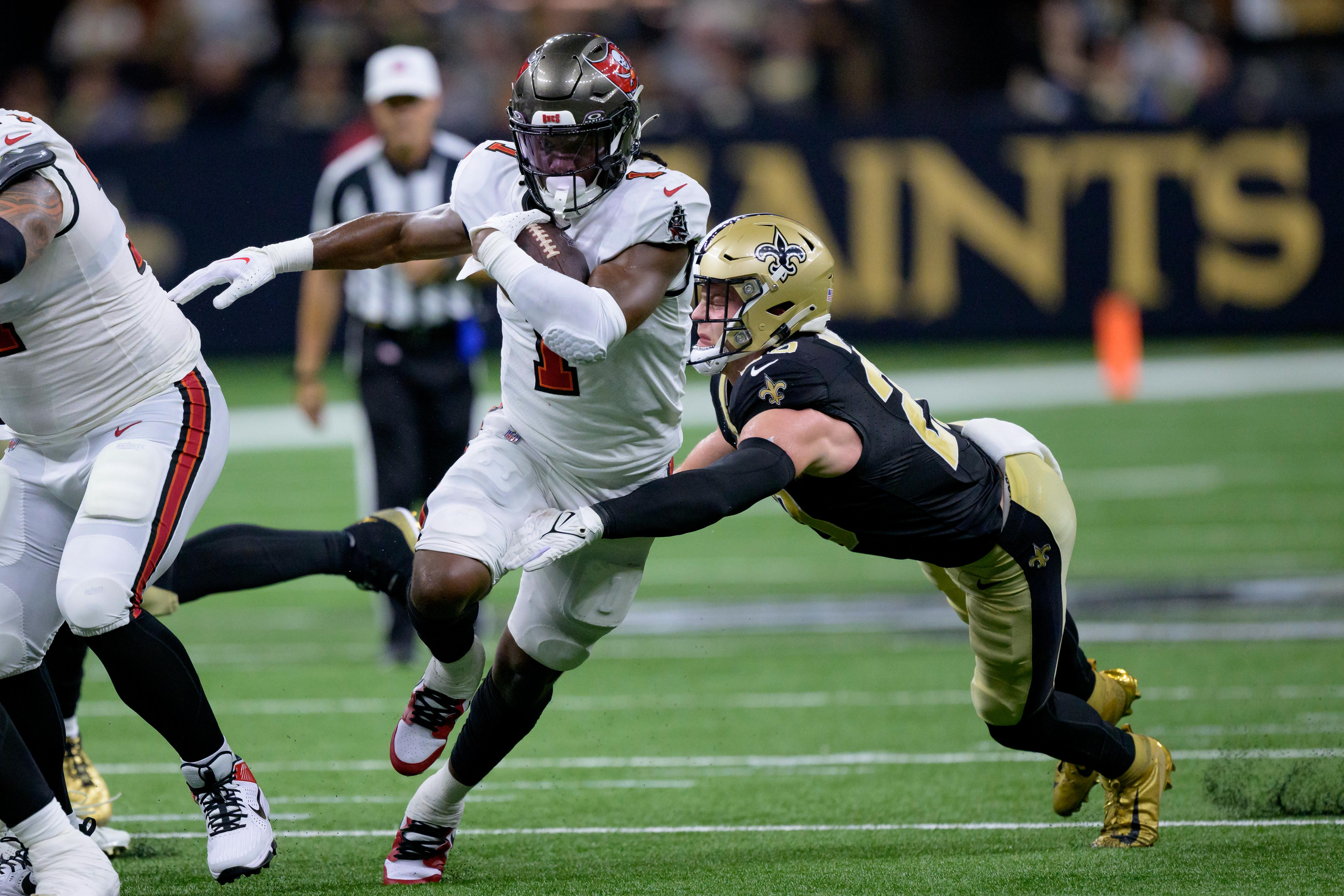 Oct 1, 2023; New Orleans, Louisiana, USA; Tampa Bay Buccaneers running back Rachaad White (1) runs against the New Orleans Saints during the second quarter at the Caesars Superdome.