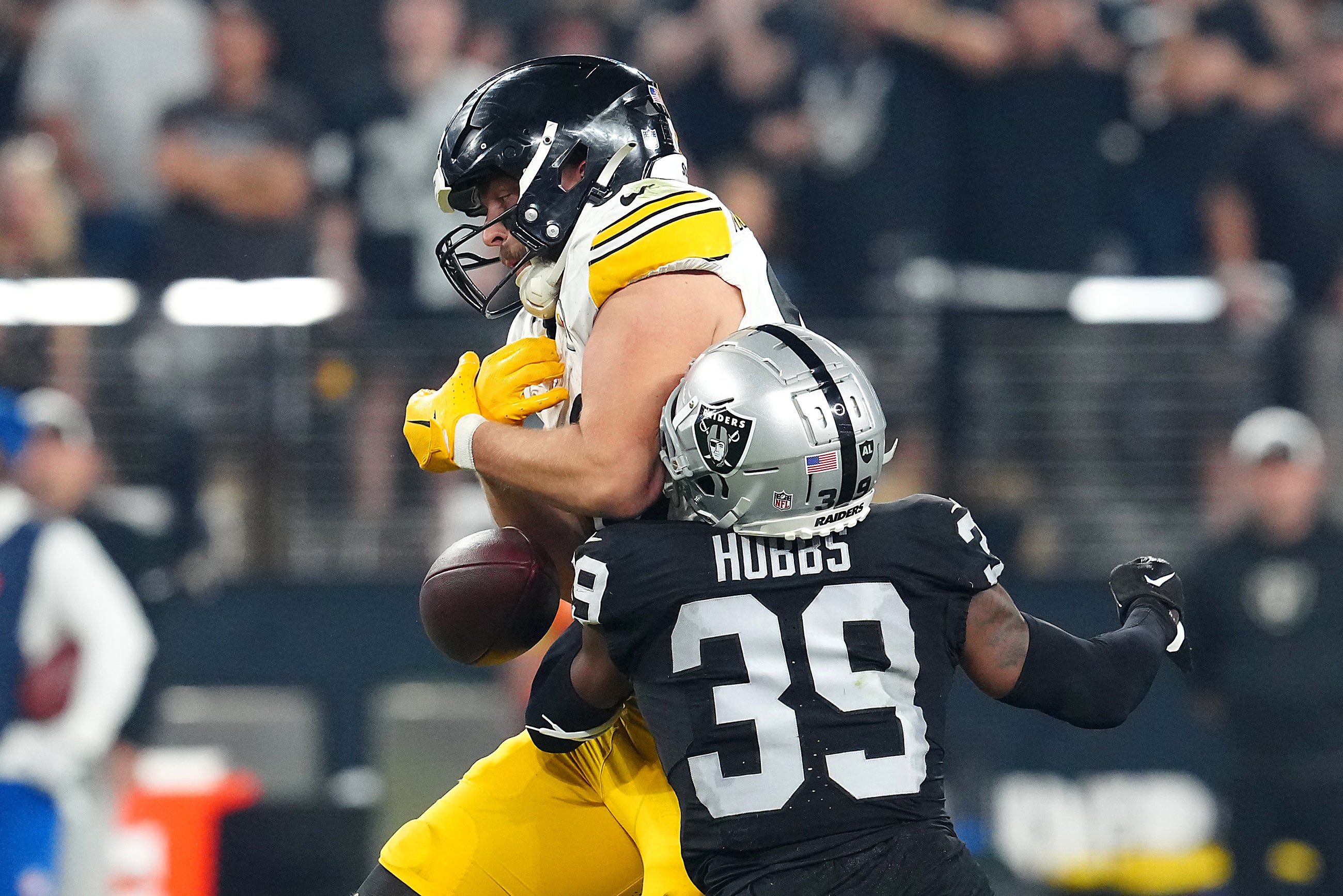 Sep 24, 2023; Paradise, Nevada, USA; Las Vegas Raiders cornerback Nate Hobbs (39) breaks up a pass intended for Pittsburgh Steelers tight end Pat Freiermuth (88) during the fourth quarter at Allegiant Stadium. Mandatory Credit: Stephen R. Sylvanie-Imagn Images